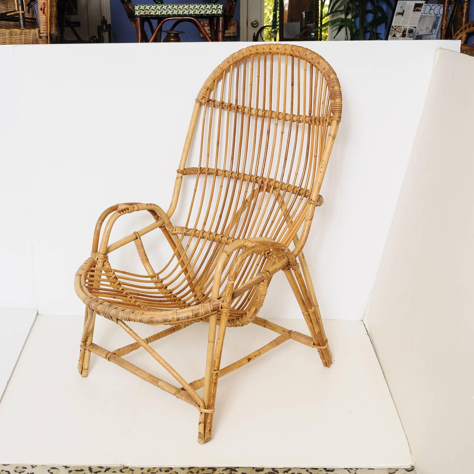 Superb French vintage bamboo settee with two armchairs and magazine rack.
Armchairs measures: 40 H, 24 W, 36 D, seat high 15.