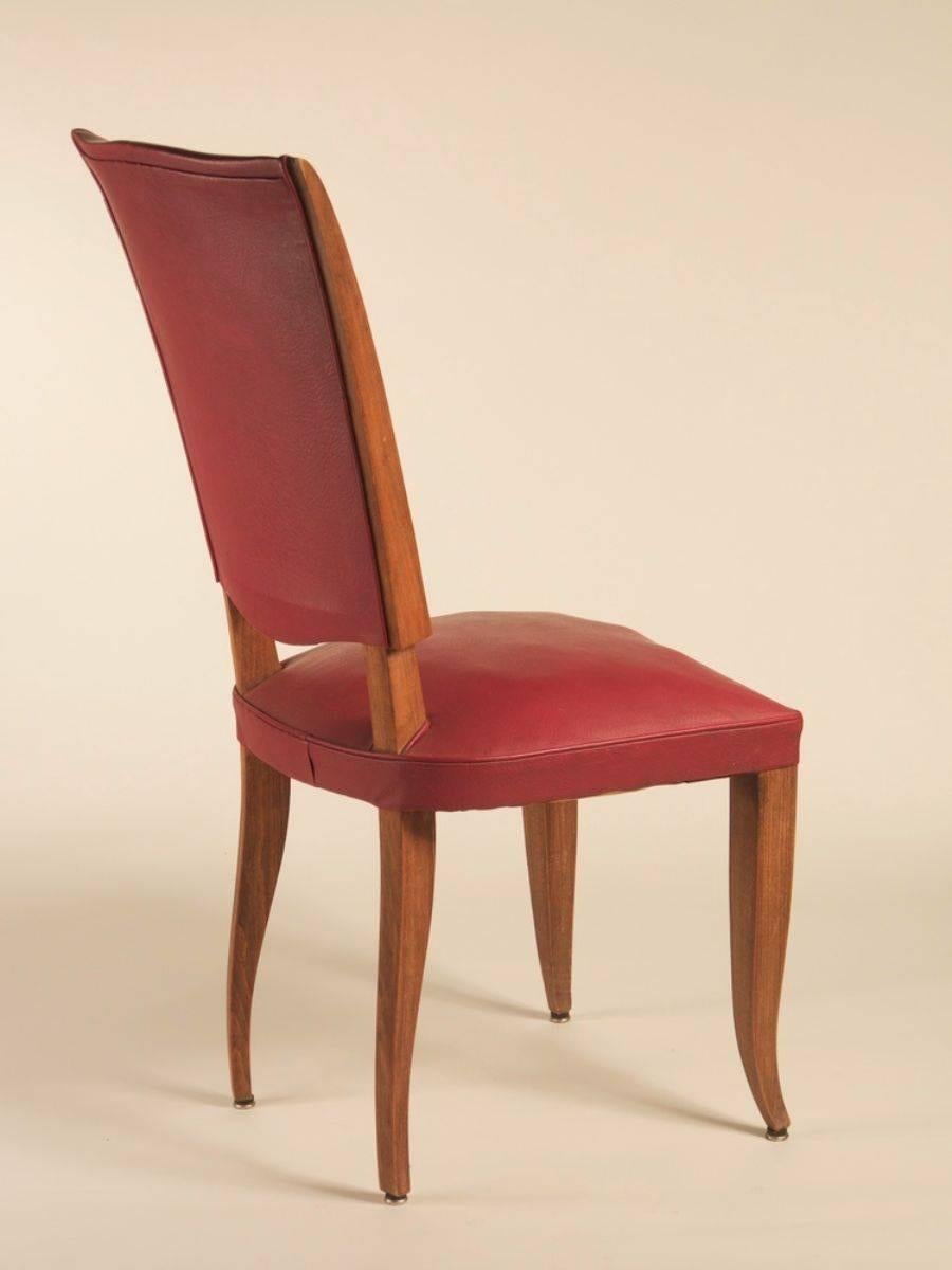 French 1940s Art Deco dining chairs, set of eight in beech.

Please note these chairs are unrestored in the photographs. Chairs can be custom-stained. We will be happy to discuss your wood color preference.
 