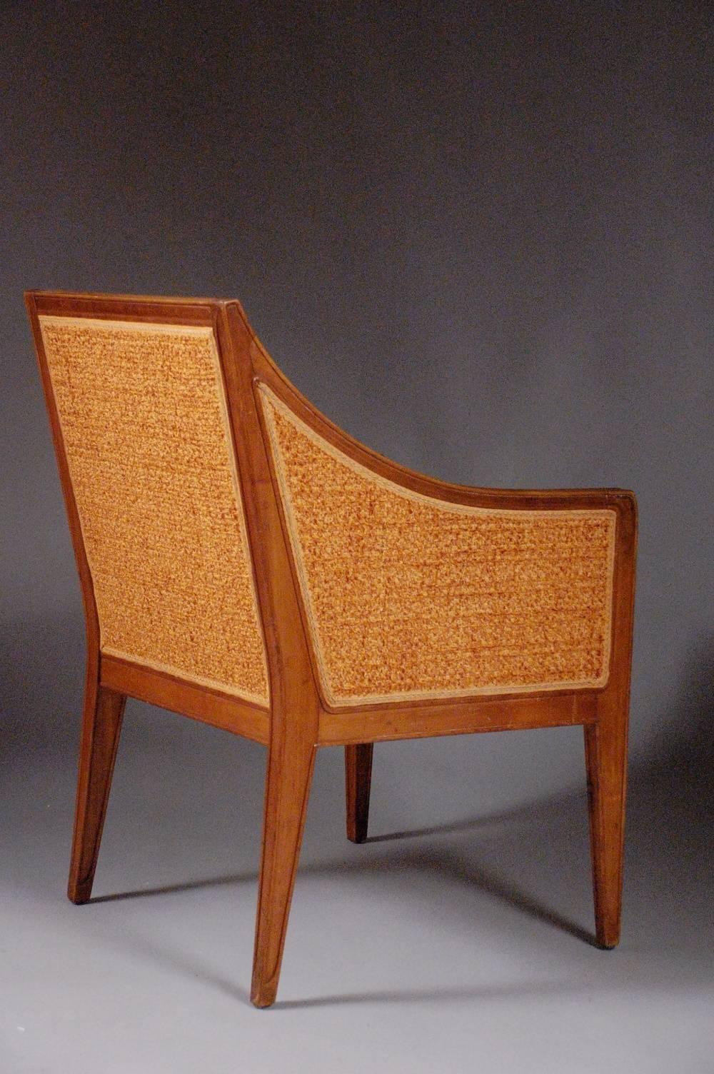 This beautiful pair of early Classic Art Deco armchairs by Leon Jallot were created in sculpted French walnut, circa 1912. Léon Jallot's career began as the cabinetmaking foreman for l'Art Nouveau Bing - the shop in Paris that gave the Art Nouveau