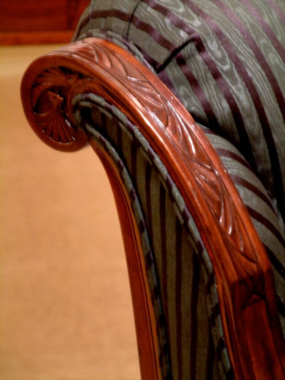 Pair of sculpted mahogany armchairs, French, 1910. Model exhibited at the 1910 Salon des Artistes Decorateurs. Documented.