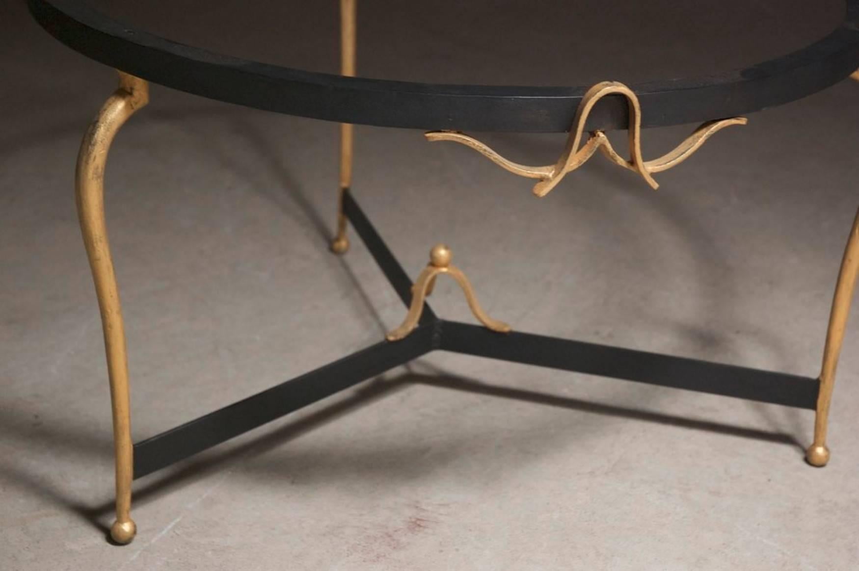 French, 1940s, Art Deco coffee table by René Prou in forged iron with gilding.