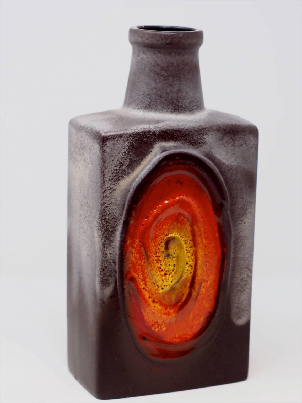 German ceramic vase with colored swirl design.