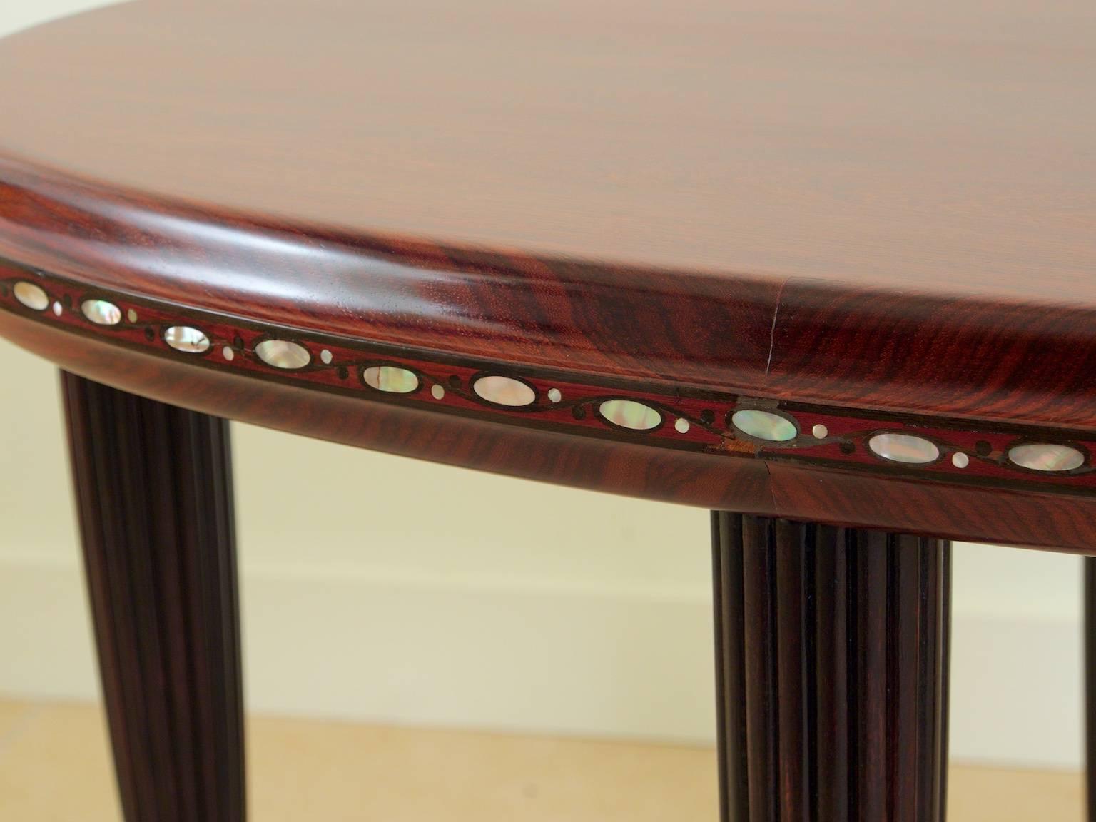 Classic French Art Deco side, end or coffee table by Maurice Dufrène. Purple heart, mahogany and mother-of-pearl.
 