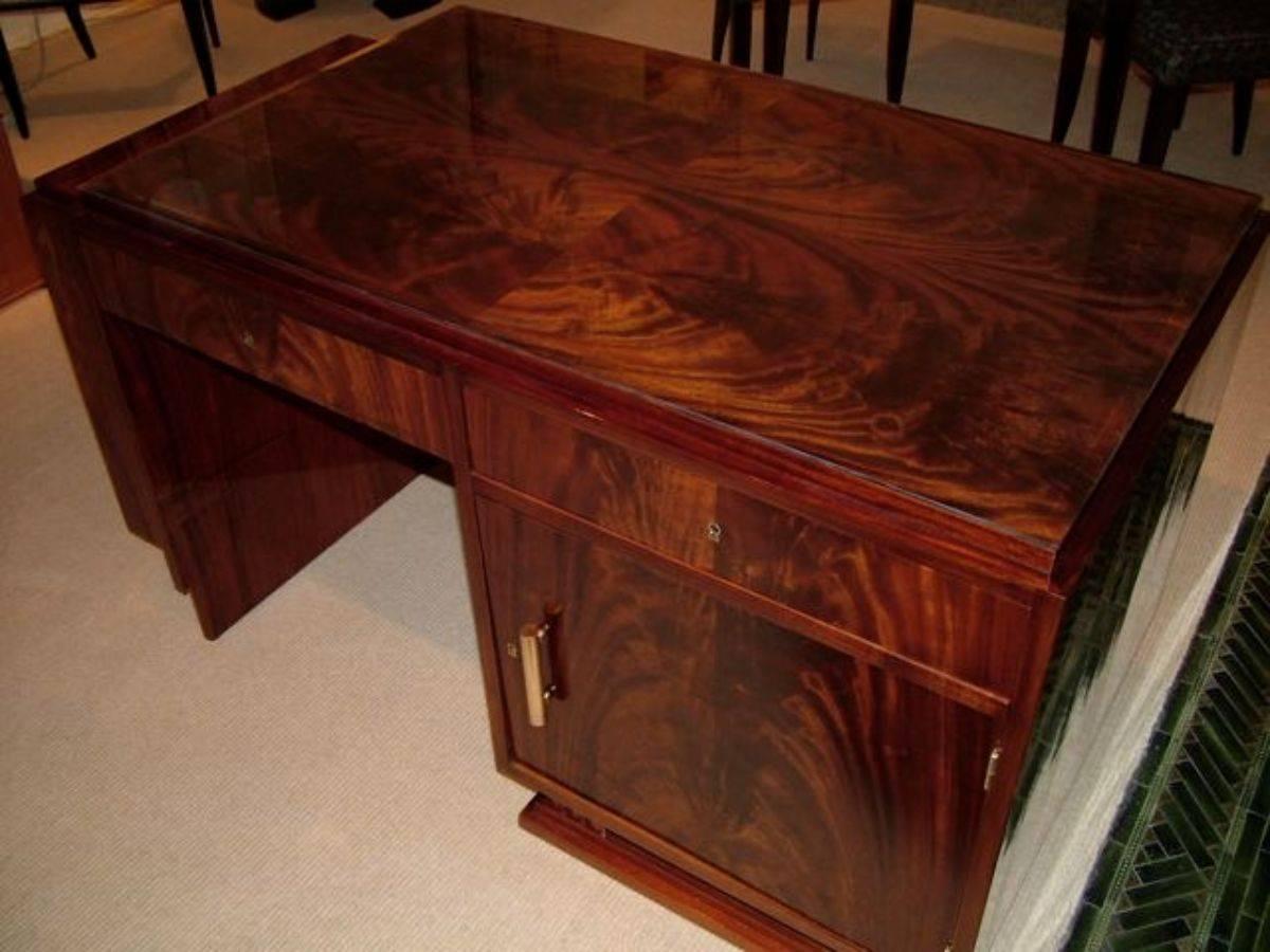 French modernist Art Deco desk in figured mahogany with bronze mounts, circa 1935.