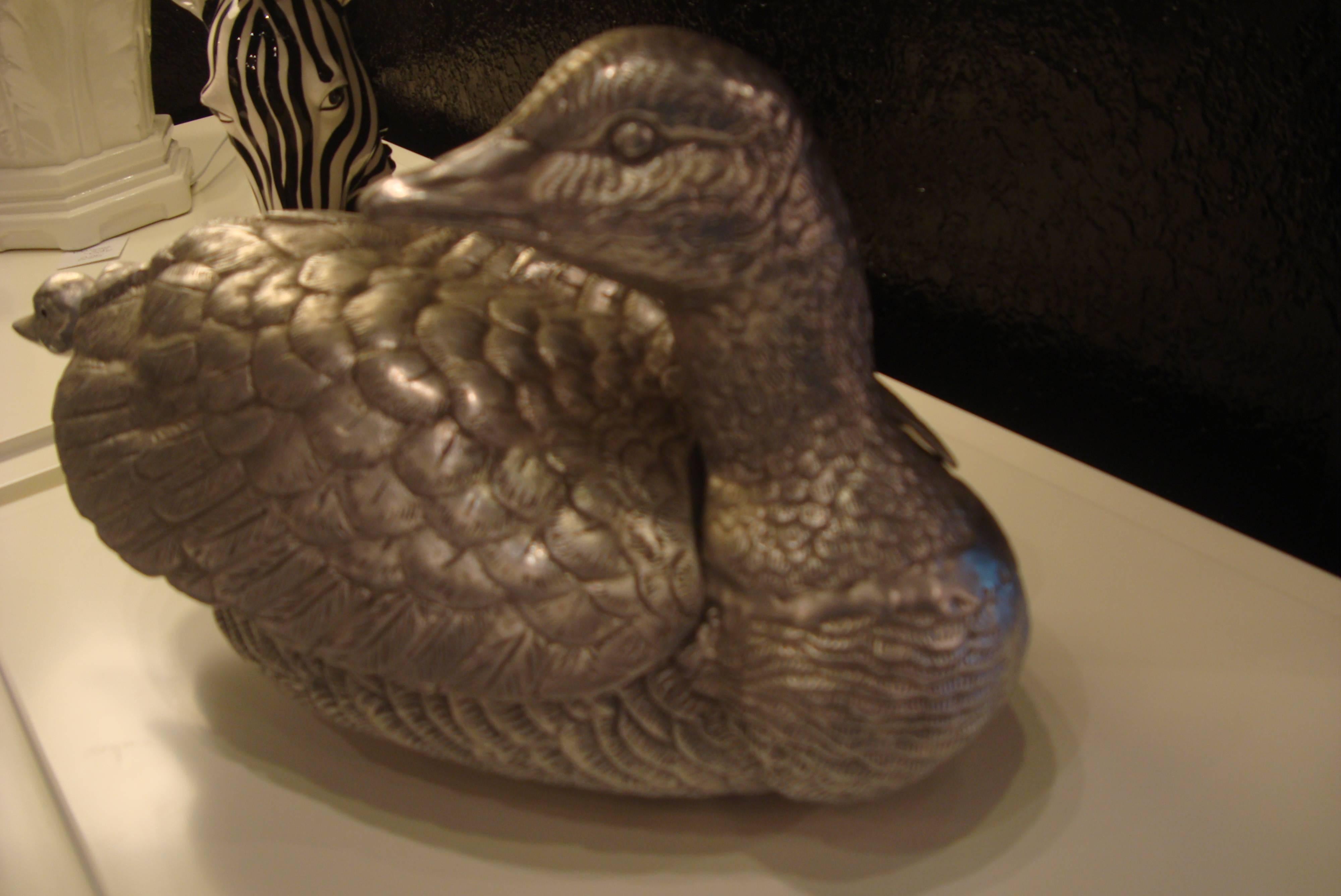 Distinguished three-piece goose tureen with winged cover and small goose ladle.
Finely defined features including feet.