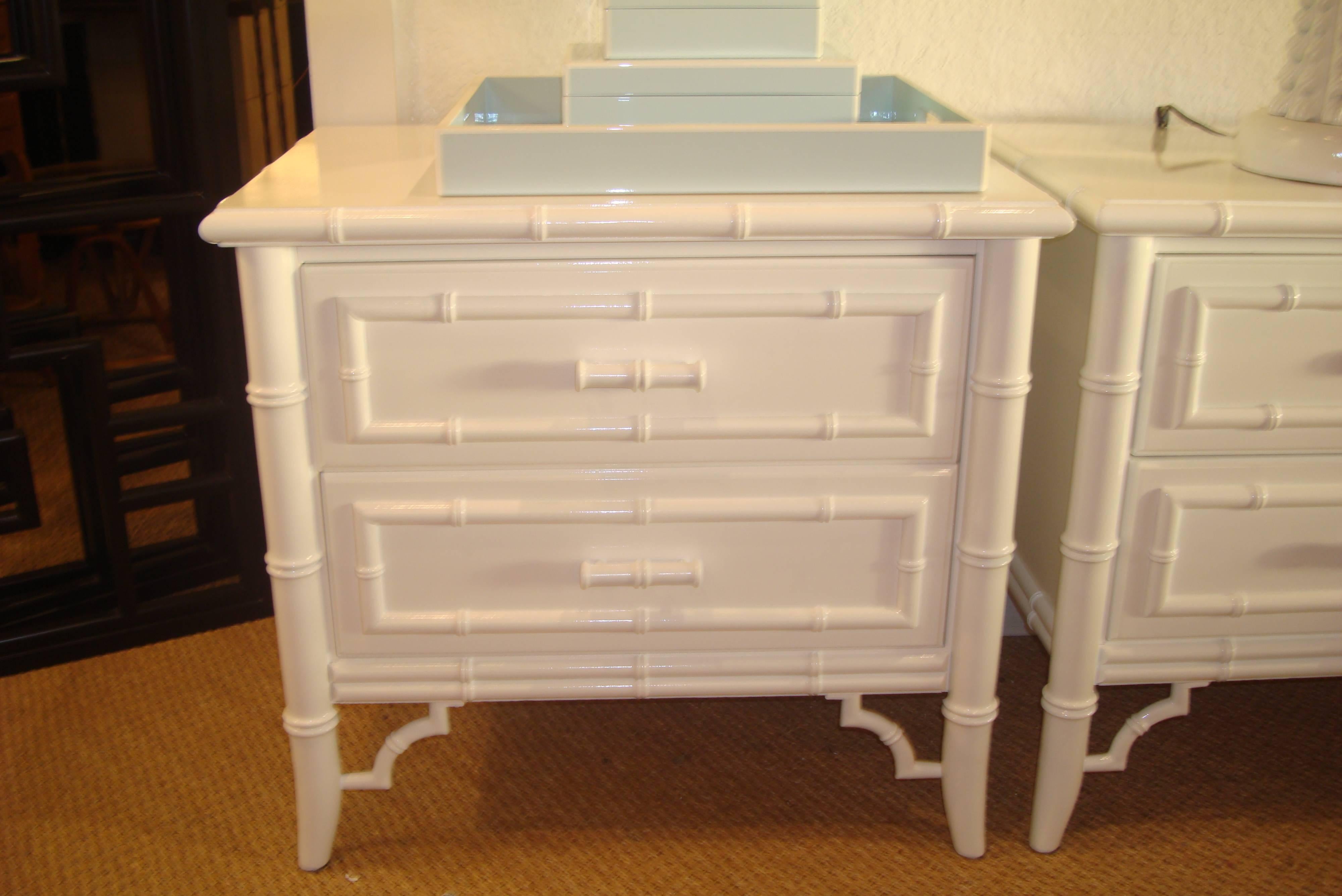 Pair of Newly Lacquered White Gloss Two Drawer Side Dressers. Faux Bamboo Frame with Fretwork Detail and Faux Bamboo Pulls. Finished Interior Drawers