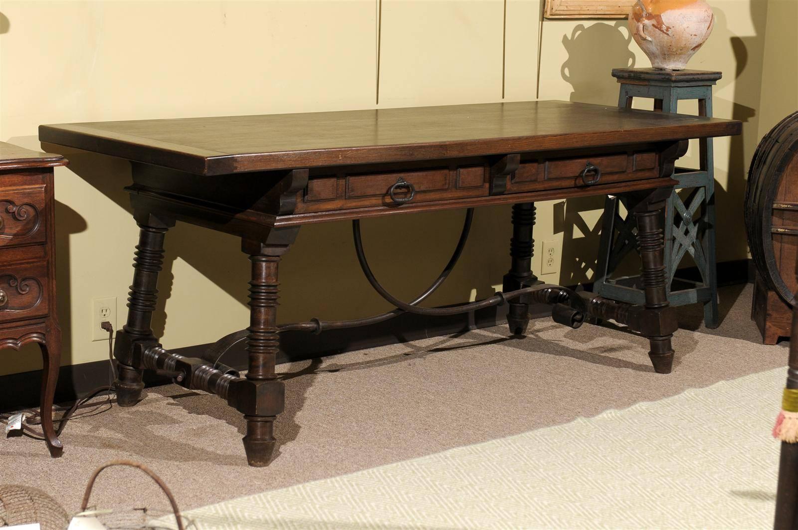 This is a versatile table. If you have the room, it doesn't need to be used as a desk. The design, with it's carved legs and iron stretcher, makes quite a statement.