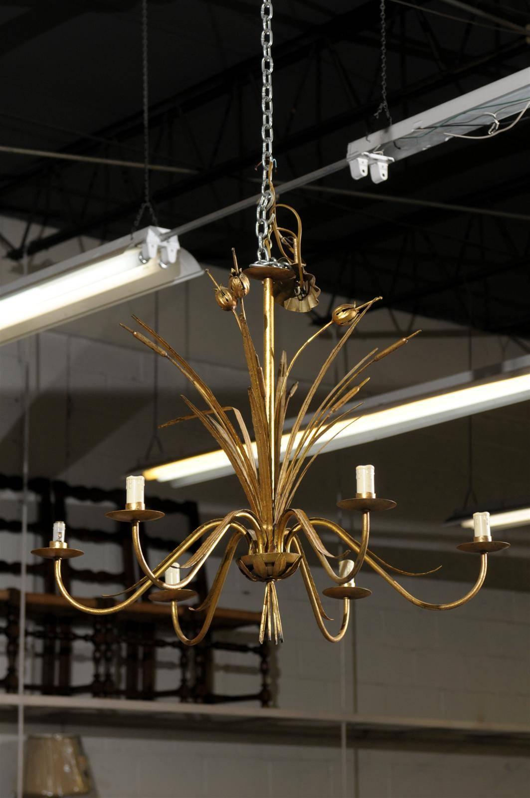 Mid-Century Six Light Gilded Chandelier from France, circa 1950
A light and airy six arm chandelier. The pond fronds and cattails give this chandelier a whimsical character. The price listed is the unwired price. We are in the process of having it