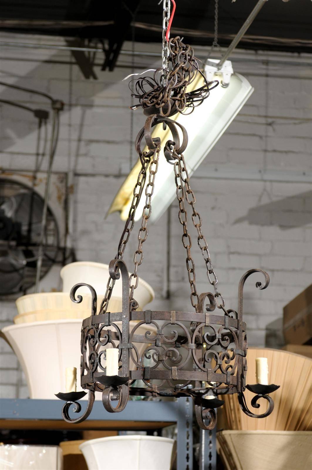 Vintage Wrought Iron Four Light Chandelier, circa 1950
For a small space, this wonderful chandelier would be very charming.  It has four lights and has been rewired.  Original chain and top piece are included.  It is ready to hang.  