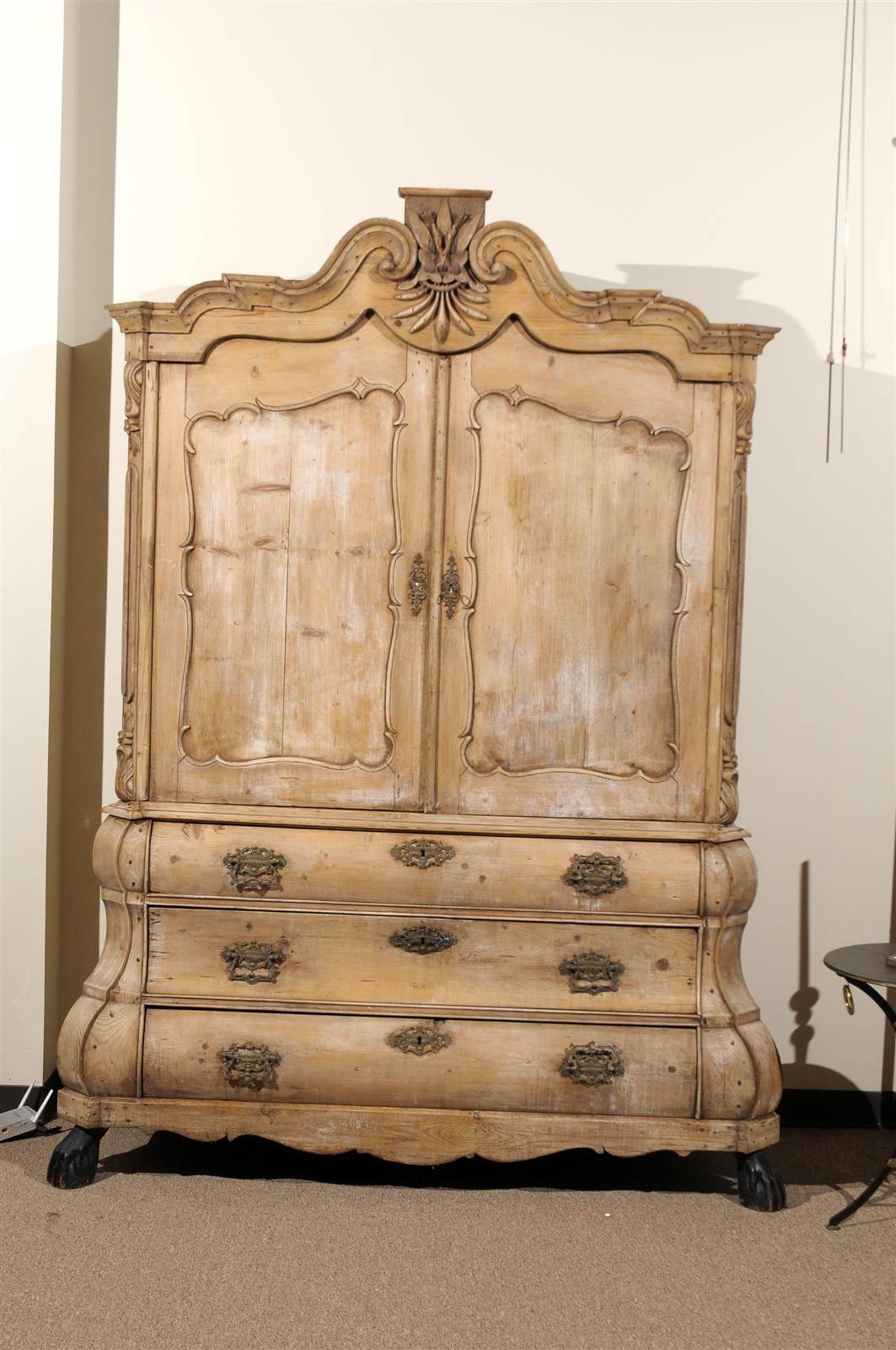 This is a charming pine cabinet with doors above and three large drawers below.  We have had a few of this kind of piece before but this one has a particularly nice appearance.  There is very little finish on the pine but the surface has a luster