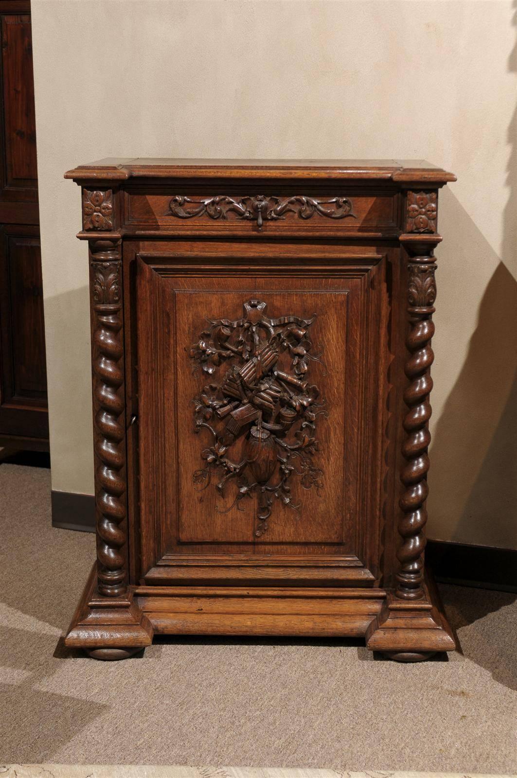 For a small cabinet, this piece has a lot of detail work. We bought it in Normandy, where the heavier styles of furniture originated. Made of oak, our little confiturier also has several shelves and a drawer offering great storage.