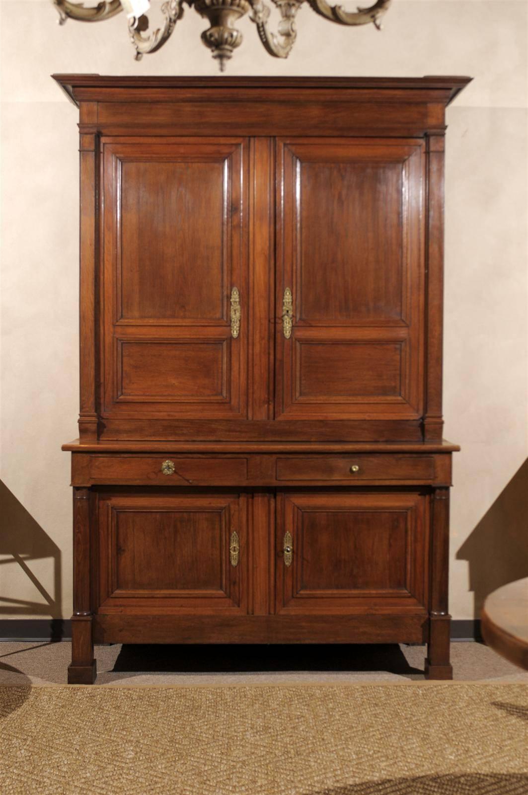 Found outside Chartres in a quaint old farmhouse, this Empire buffet deux corps is made from the French oak of the region. The wood has a wonderful patina and a very pleasing color tone. One might even think it's cherry from across the room. This
