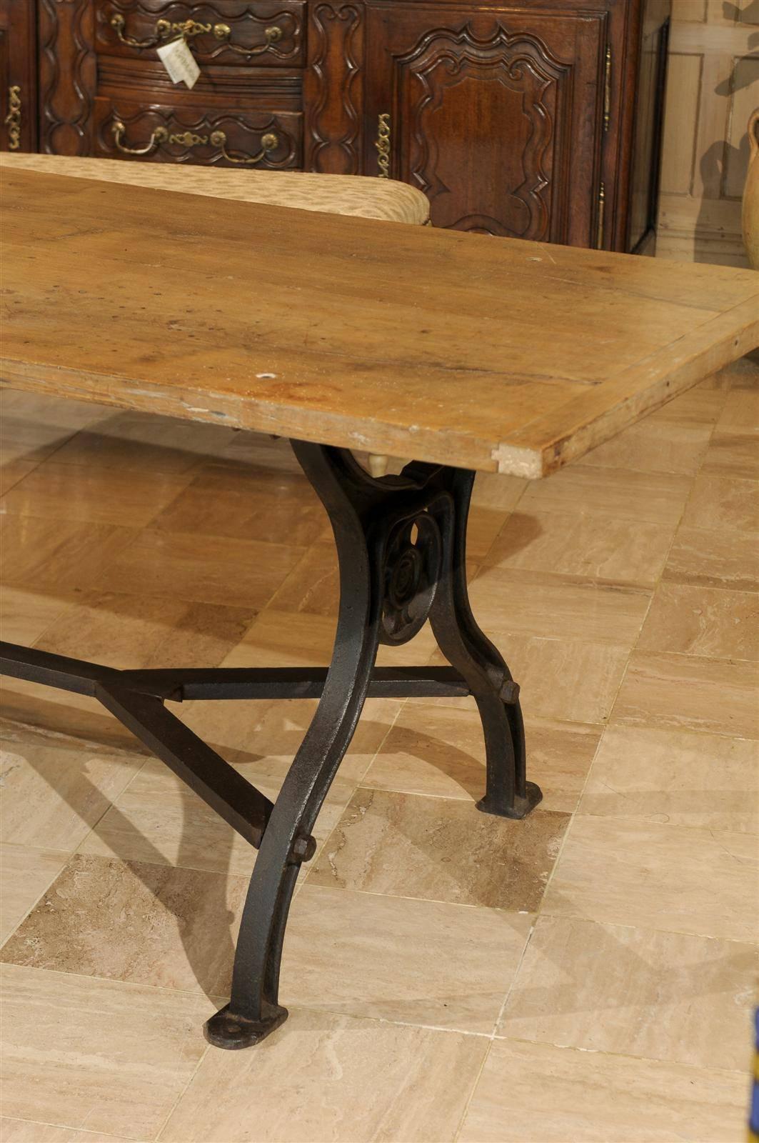 Dining Table with Industrial Iron Base and an Old Wooden Top In Distressed Condition In Atlanta, GA