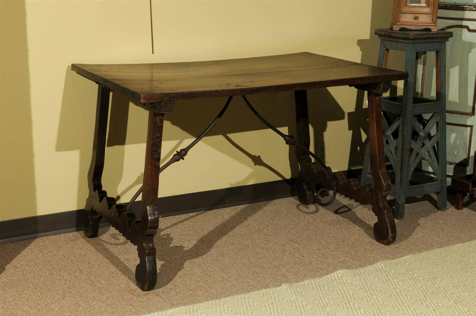 18th Century Spanish Table in Dark Brown Oak with Iron Stretcher, circa 1780
This lovely rustic 18th century table is handmade in rich dark oak. It would make a great library table or center table in a more casual setting. It would also make a nice