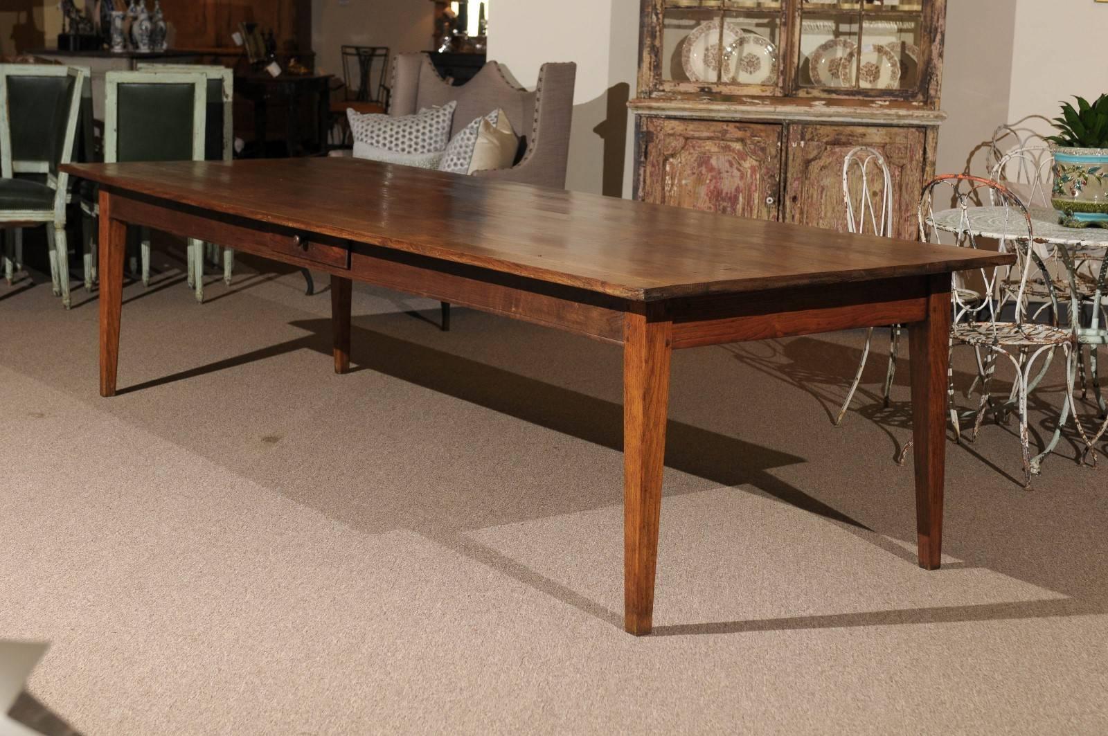 Large tables to seat 12 are difficult to find. We found this one in Normandy. The wood is chestnut and the tabletop has lots of interesting wood grain making it a beautiful and pleasing table to sit at. The color is very warm.