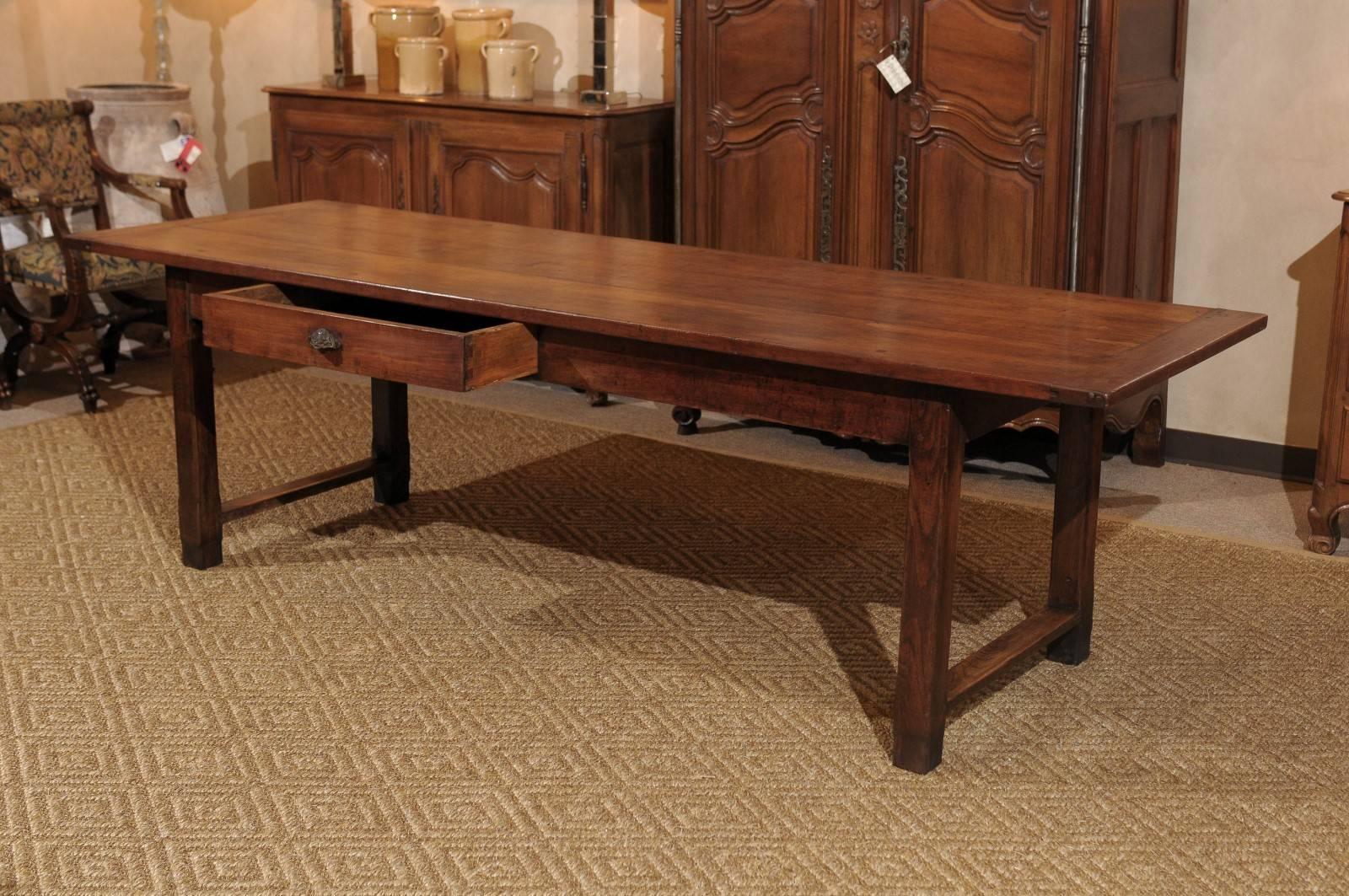 Mid-Century French Cherry Farm Table, circa 1945
This is a beautiful cherry farm table. It has a planked top and one drawer.  The length at 103 inches is very appealing for large dinner parties and family gatherings. The stretcher between the legs
