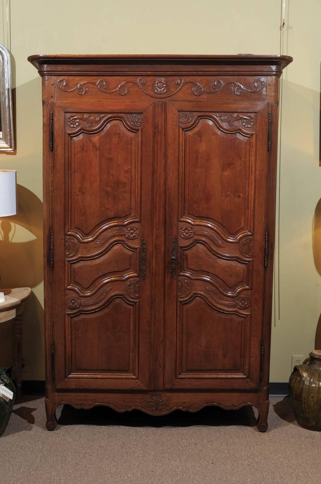 Small 19th Century Oak Armoire from Brittany, circa 1800
Great looking carvings of stylized ferns and flowers decorate this armoire and give it a look all its own. It is on the small side but is large enough to provide good storage or it could house