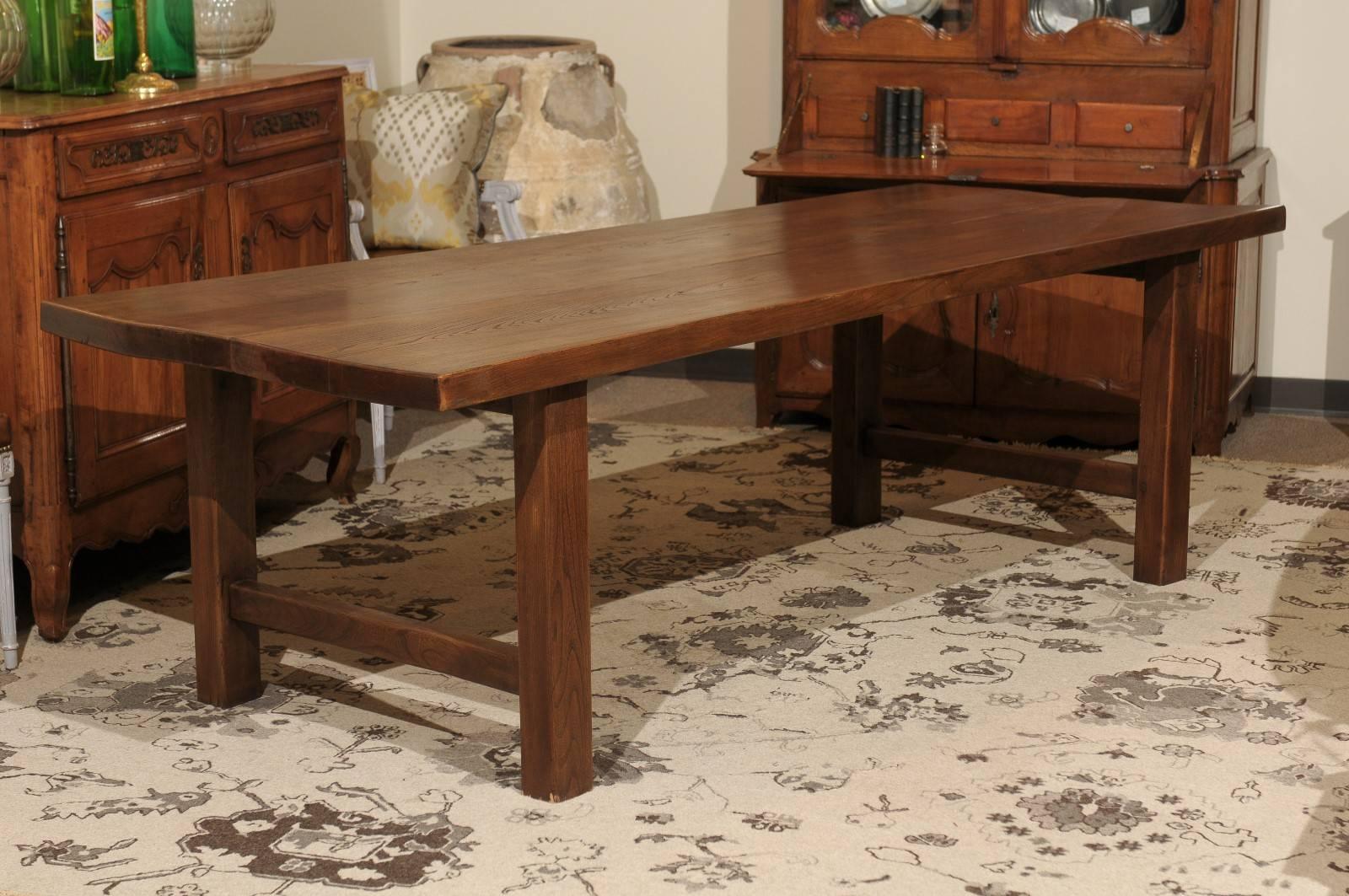 Early 20th Century French Elm Farm Table, circa 1920
This sturdy elm farm table has a very strong profile with thick legs, top and stretchers.  The beautiful patina shows the wonderful elm grain which adds interest.  We bought this table in the