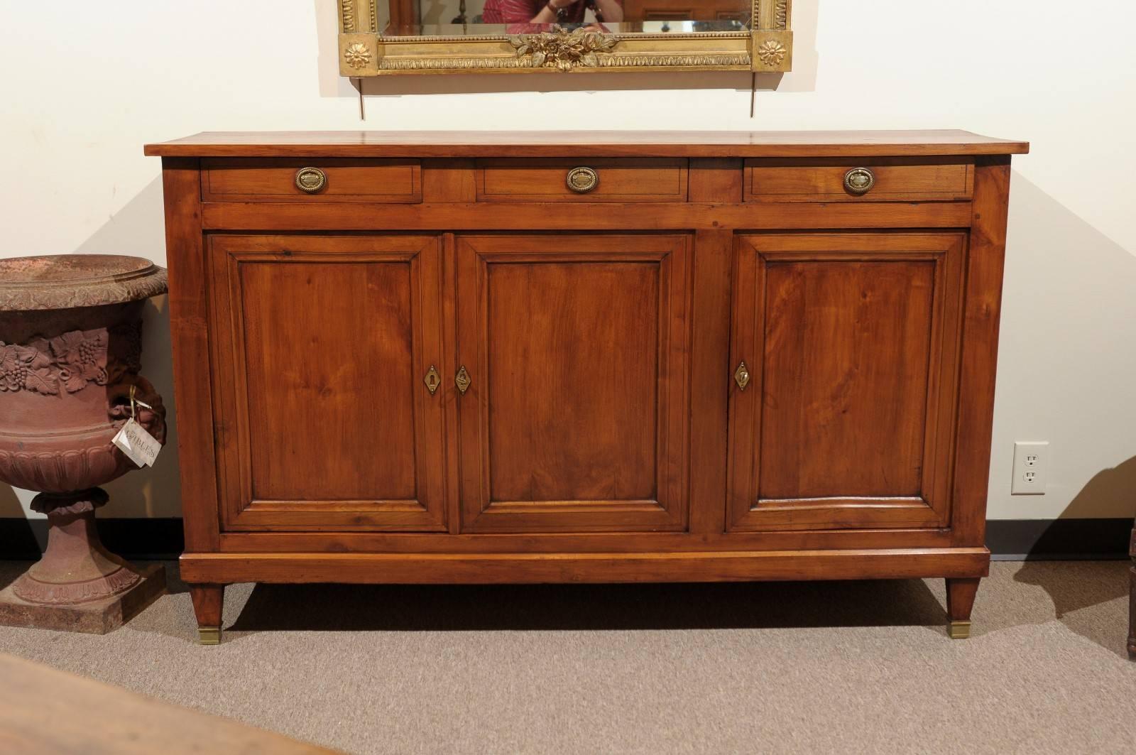 19th century cherry Directoire style enfilade, circa 1860
A very handsome enfilade in rich dark cherry with straight lines. The simple paneled doors and drawers are outlined with a thin black line.
 