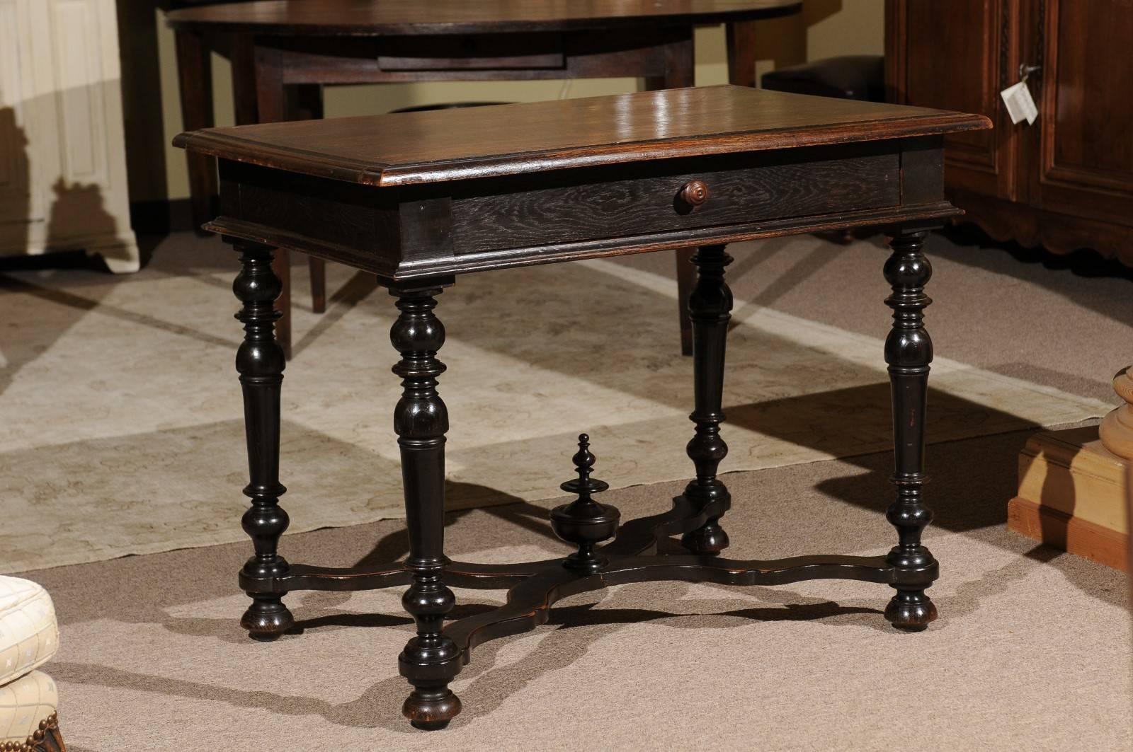 Louis XIII style tables are interesting with the turned legs and a stretcher. The dark oak has a wonderful patina and there is a handy middle drawer. This table has lots of Fine detailing around the top, the apron and of course the legs.