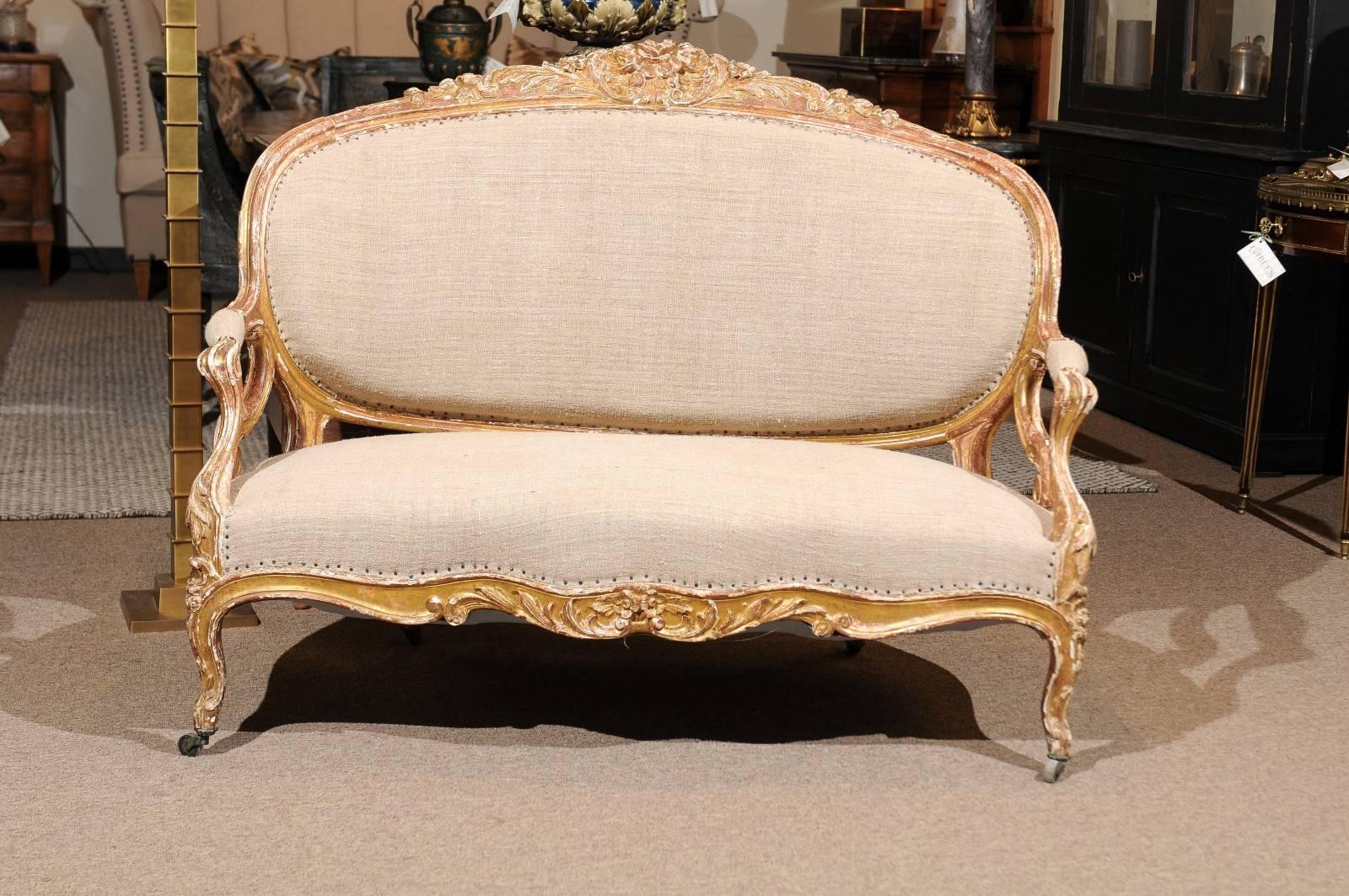 19th century Napoleon III giltwood settee, circa 1880
What a pretty little treasure! Add a touch of gilt to your decor. The settee is petite and comfortable in addition to stunning and fun. The finish is a shabby chic look, with worn off gilt and