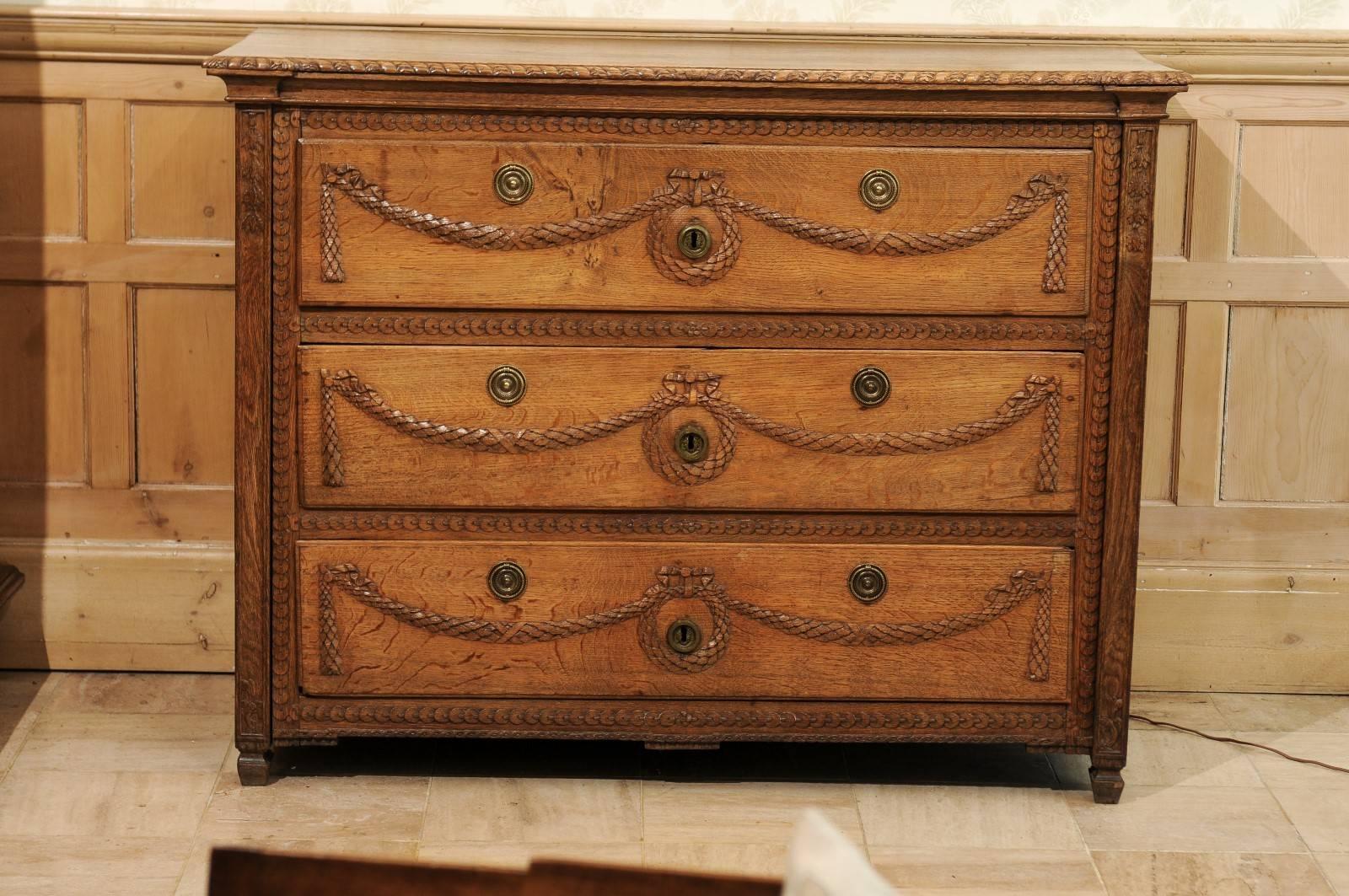 18th century Louis XVI commode, circa 1780
This finely carved chest has garlands and wreaths adorning it's three drawers. The trim is carved as well. The drawers are very functional and deep so they have good storage. The pulls are not original to