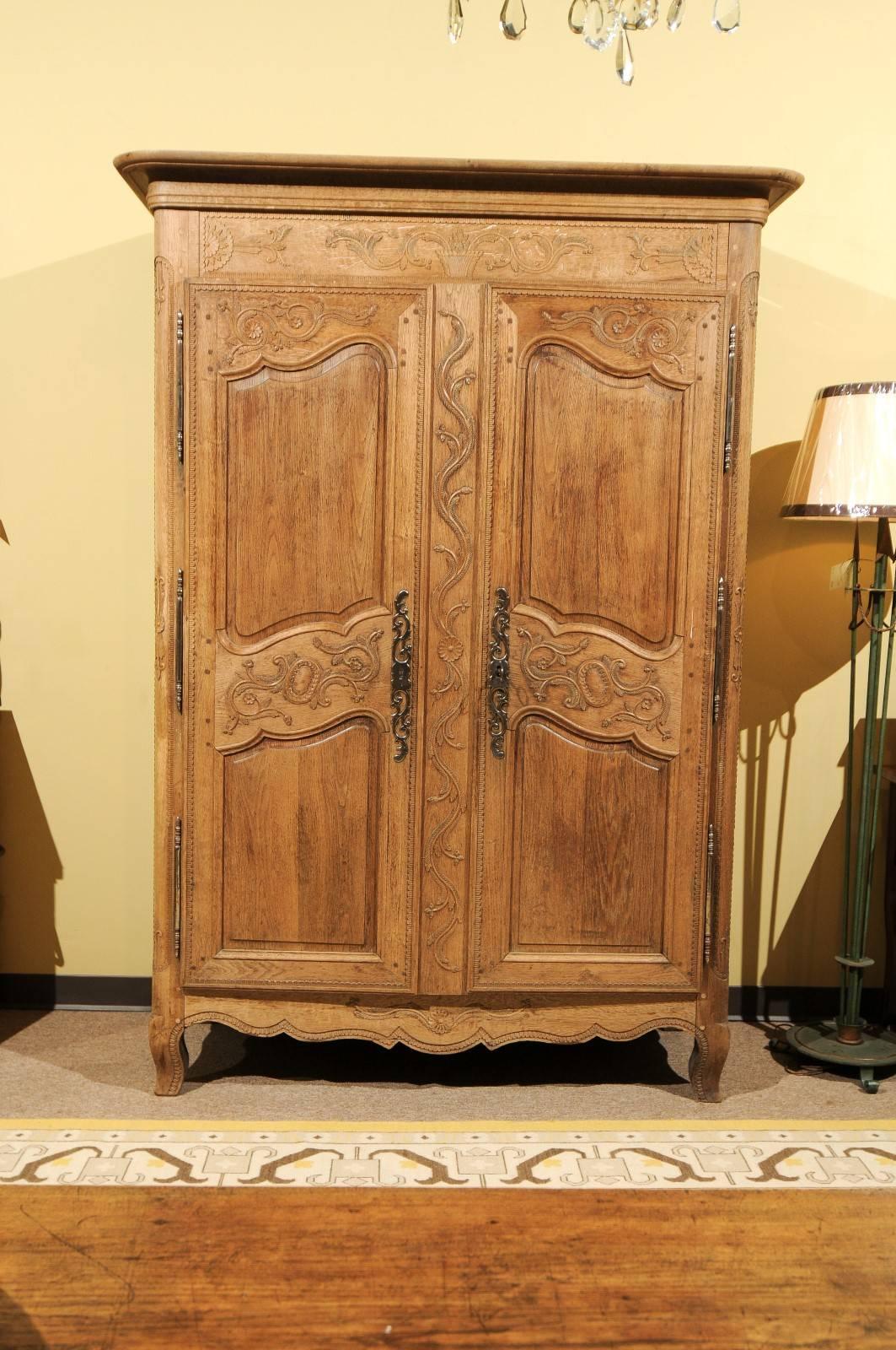 19th century carved oak armoire from Normandy

We know this armoire is from Normandy because the intricate, very detailed carving is typical of pieces from that area. In addition, oak is a native wood to Normandy and Brittany and often the first