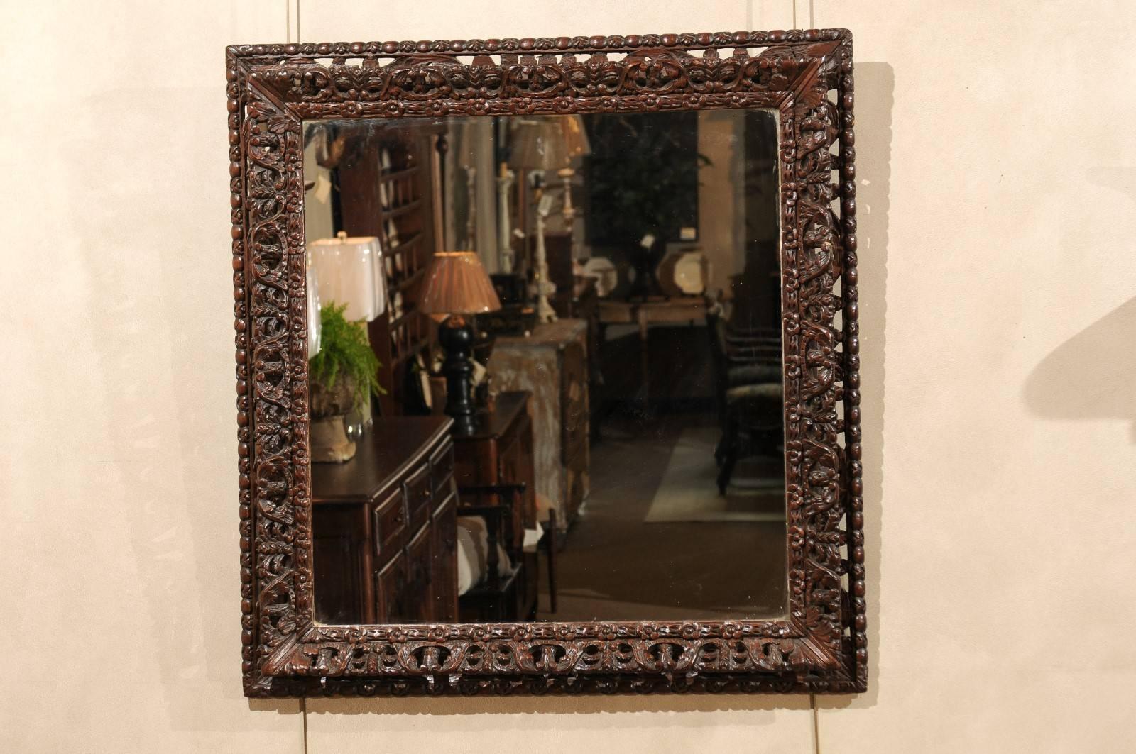 Early 20th century Black Forest mirror, circa 1900
A very intricately carved frame, in dark oak, interspersed with small small flowers from the Black Forest. The shape is not quite square but gives the appearance of square.