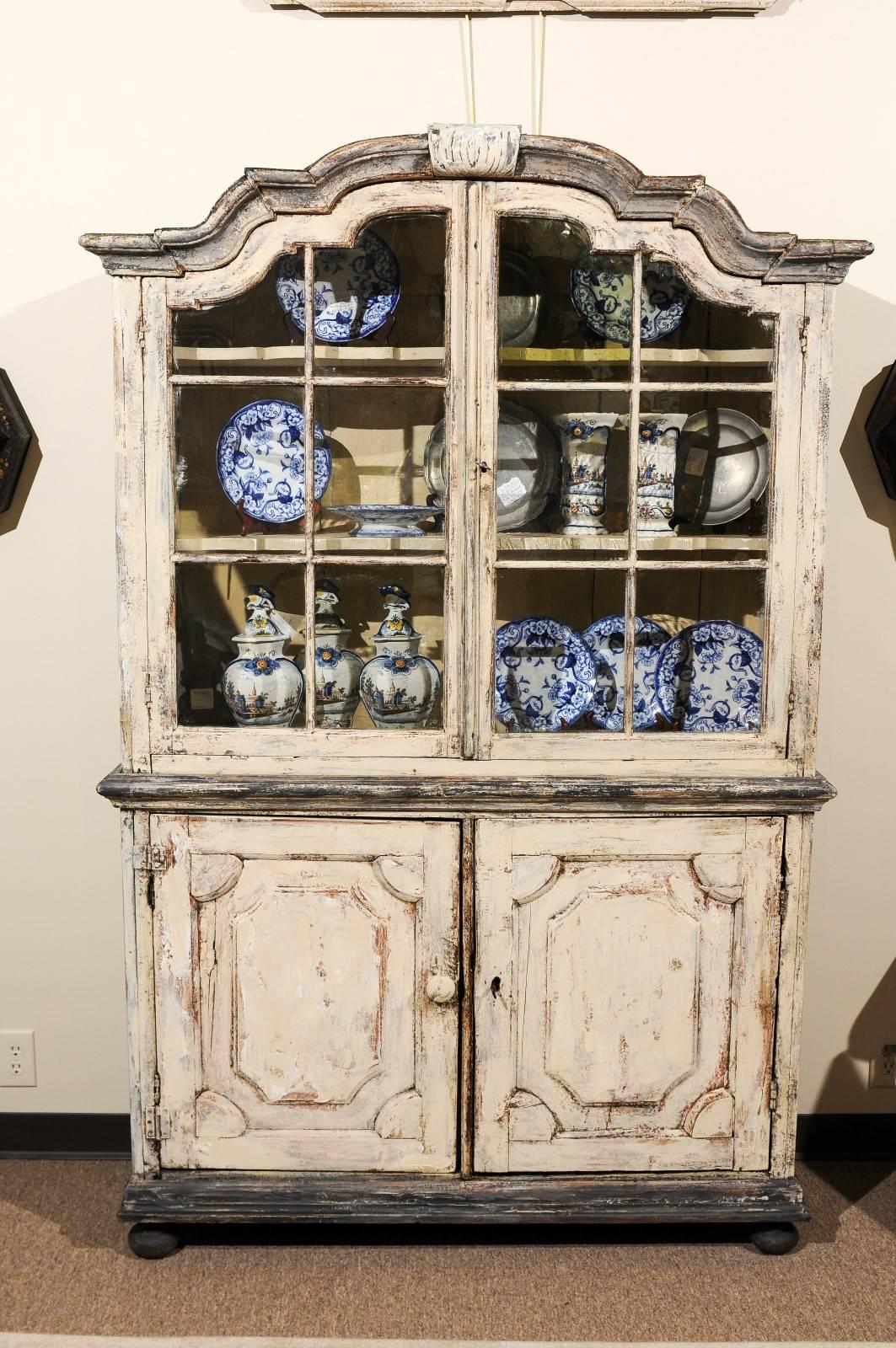 18th century Dutch buffet deux corps in a painted finish, circa 1780.
A rustic piece with lots of charm, this buffet deux corps is a typical style of the Dutch craftsman. The cornice, bun feet and the panel doors make the design interesting. The