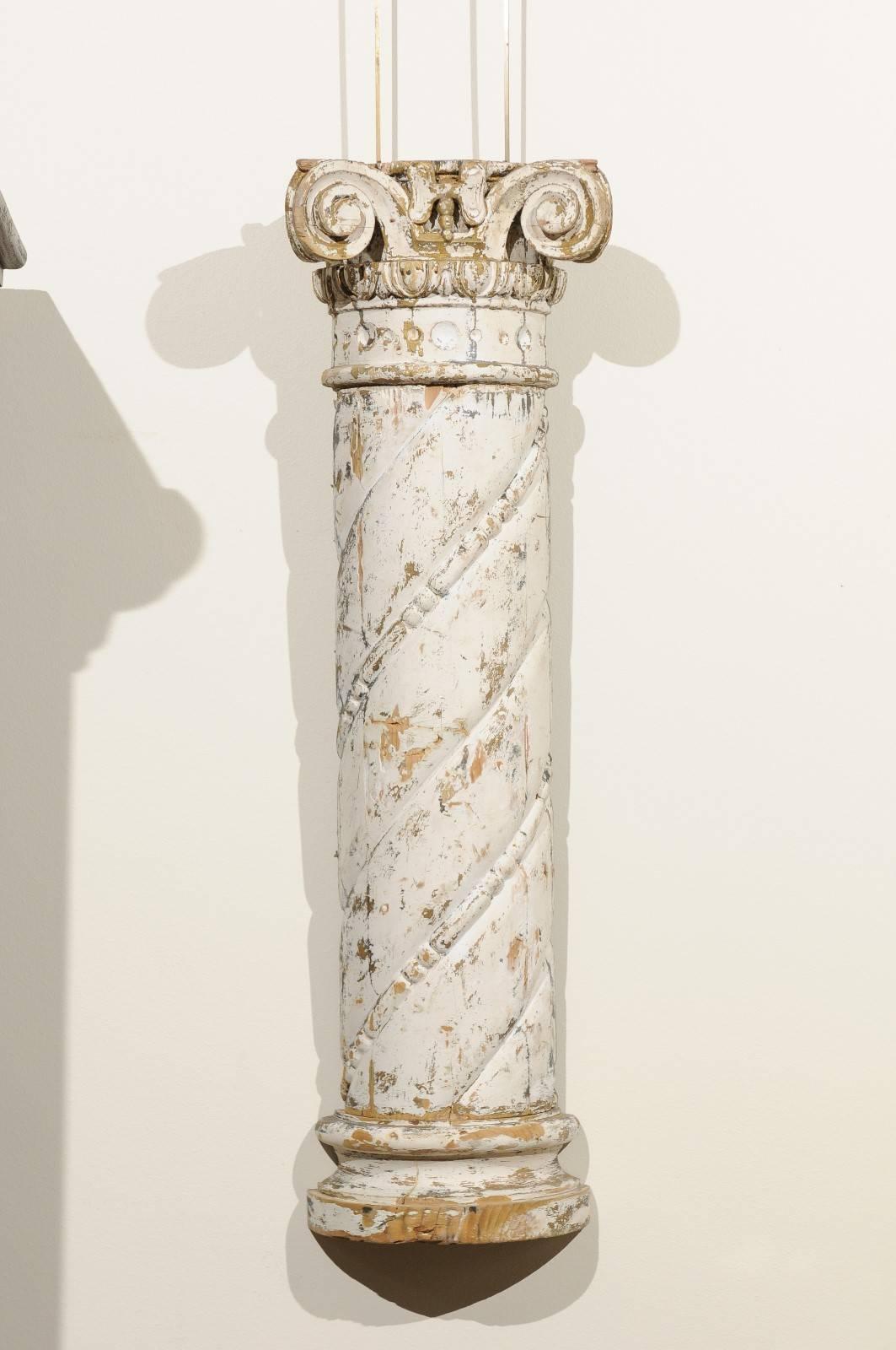 Pair of 18th century carved wood white columns, circa 1790
A pair of stylized Ionic columns that were originally mounted on a flat surface in the 18th century. Today they can add interest to your space when you use these architectural elements. The