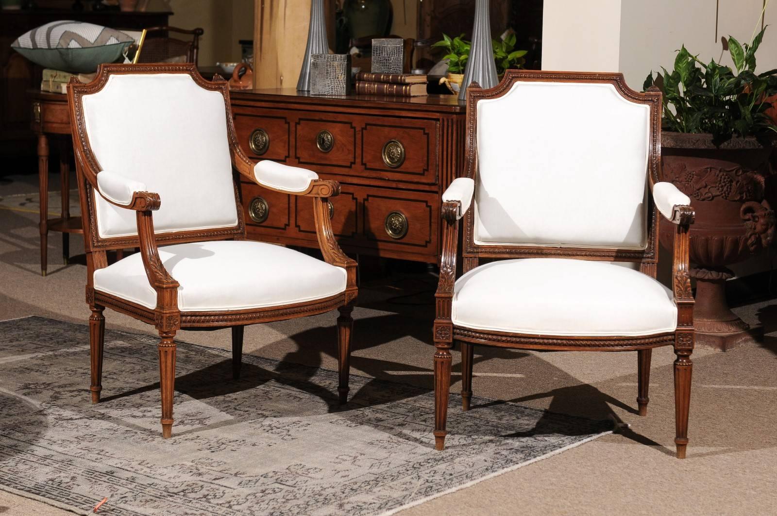 Pair of beautifully carved walnut Louis XVI style chairs
These chairs is very nice proportions that can easily fit in any room. They are newly upholstered in muslin so they are very comfortable and ready to go as they are or with the addition of