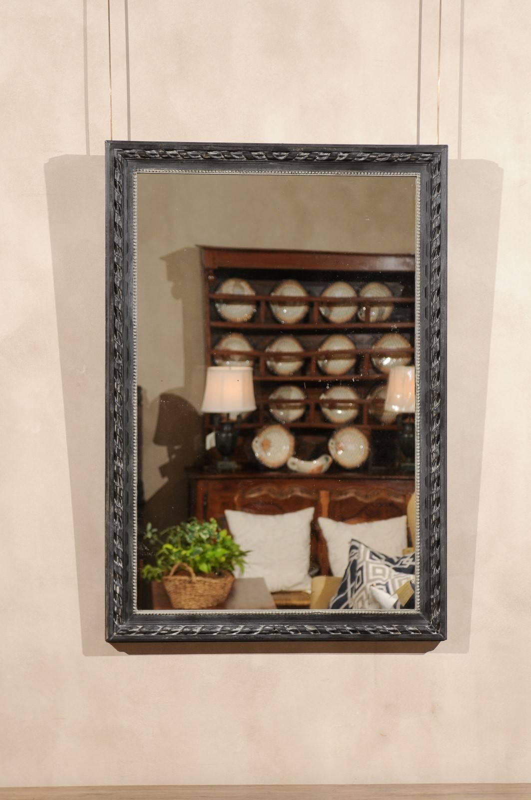 19th century French black mirror, circa 1890
This very simple mirror, has a lovely carved frame with inner beading that has recently been painted black.
The finish is a matte black which gives the mirror a more casual look.