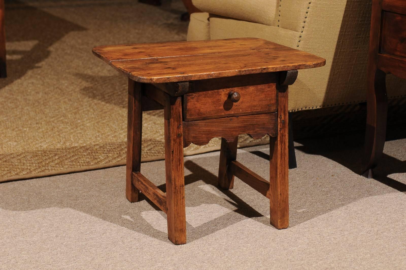 19th century pine Shepherds table from Spain
Our Clients often ask us for small tables to go beside a chair and this is a charming little solution. It is large enough for books, T.V. controllers, glasses, a drink and more. The drawer offers