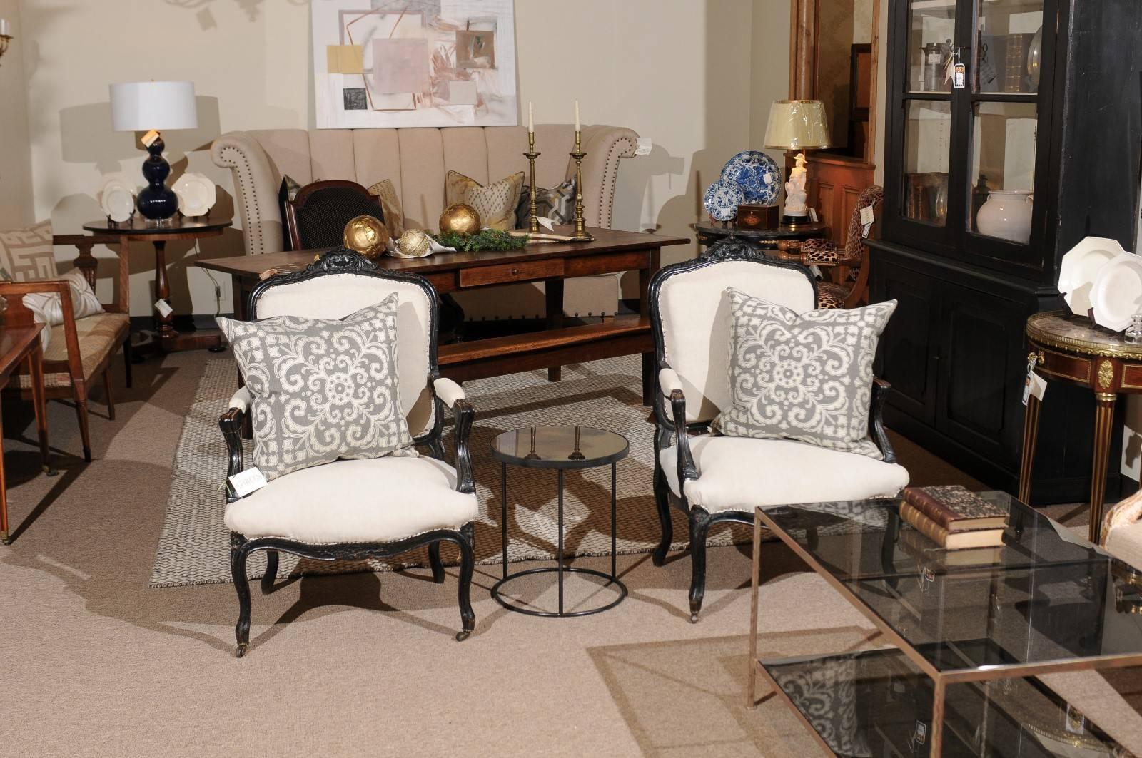 Pair of 19th century black Louis XVth style armchairs, circa 1880
A very handsome and graceful pair of Louis XVth armchairs with a painted black finish. The chair is quite comfortable and is nicely sized. It has a slightly distressed finish on the