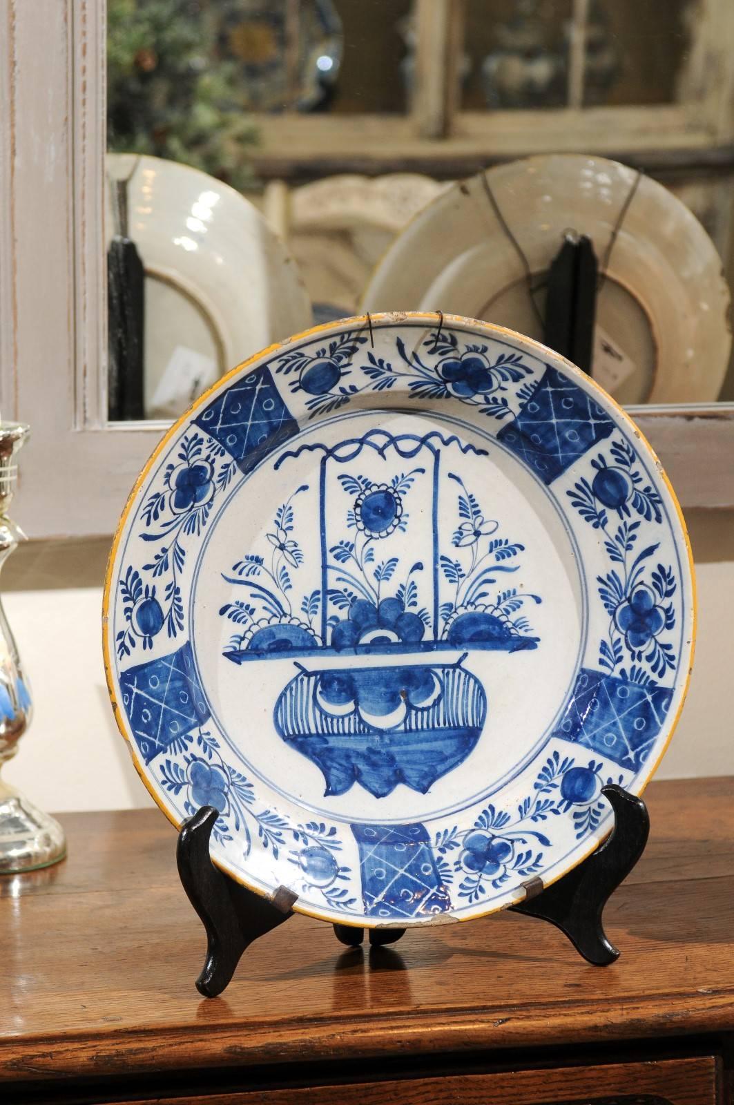 Pair of 17th century blue delft chargers, circa 1690
A stunning pair of delft chargers with a very creative design. Your first look at the center seems to be that of an urn. However, could that be bulbs underground and the flowers blooming above?