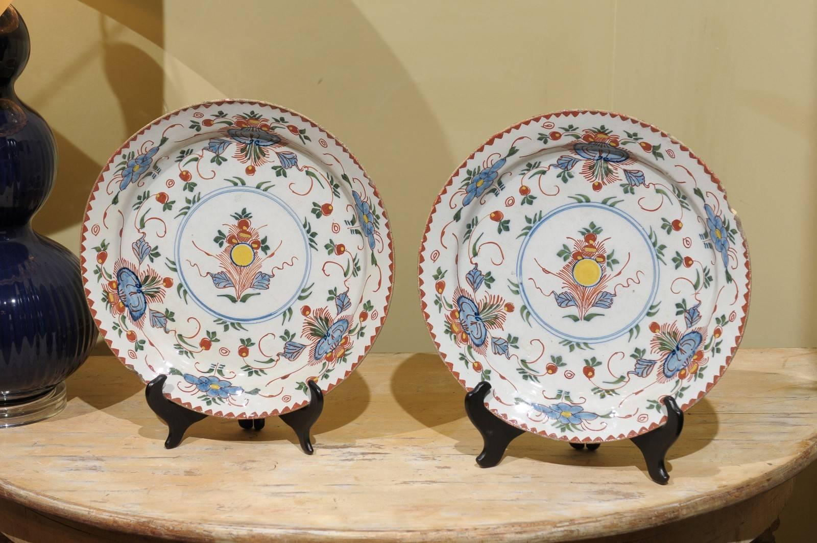 A very unusual pair of polychrome delft chargers. I love the terra cotta with the yellow and blue color pattern this artist has created. There is whimsy on display.