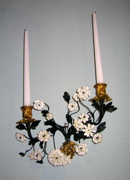 Pair of French 19th century tole and gilt bronze wall sconces with porcelain flowers
N.P. Trent has been a respected name in antiques for over 30 years with a large collection of period furniture, art and decorative accessories.