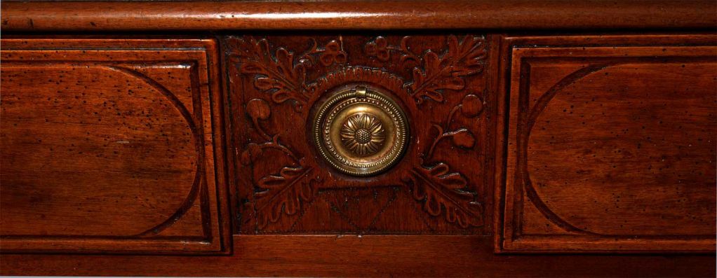 Louis XVI carved mahogany commode, late 18th century, the rectangular top above two short drawers centering a leaf carved decoration over two long drawers, the drawer fronts fitted with brass pulls, shell carved motif throughout, molded stiles