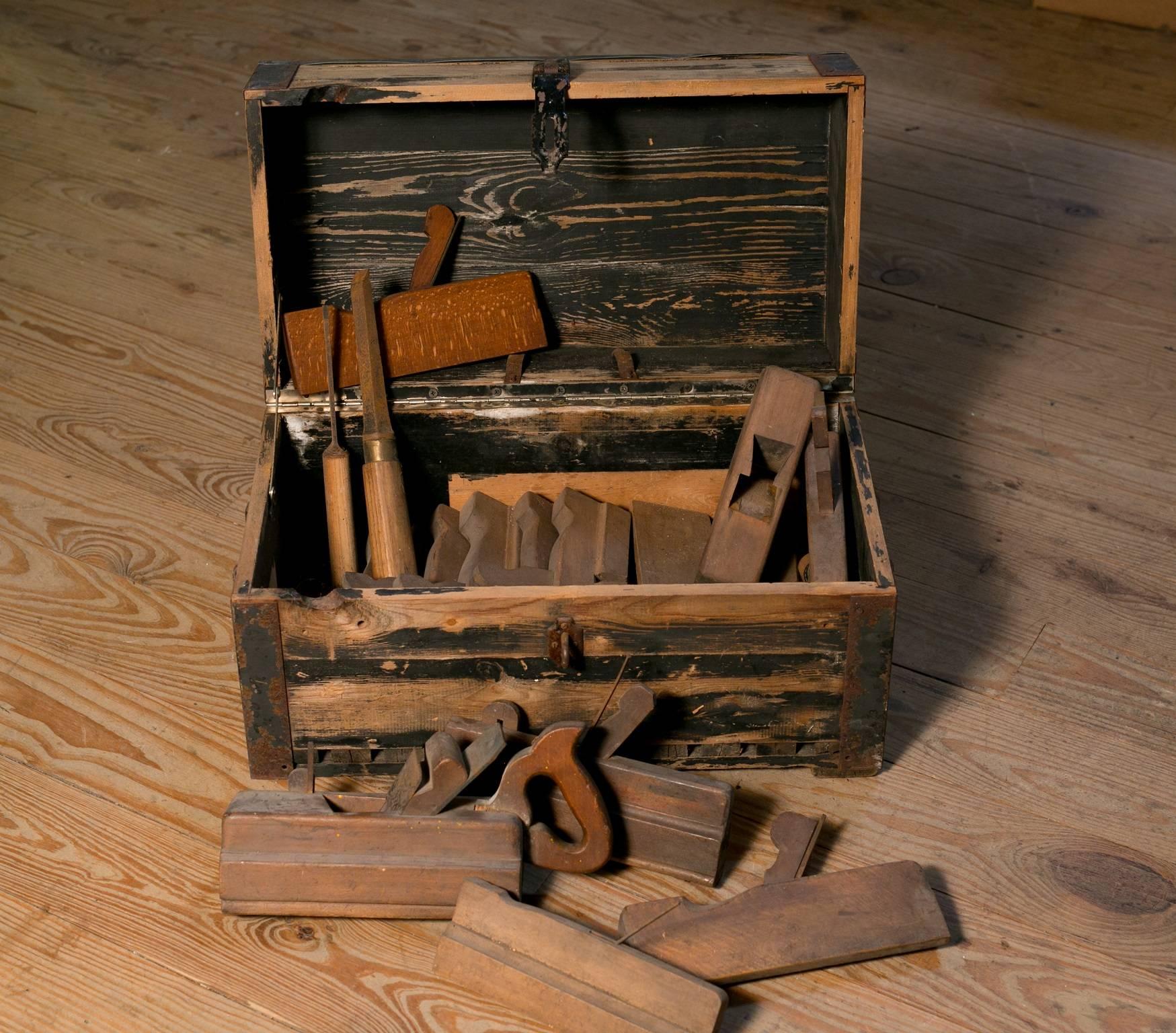 Set of at least 12 woodworking hand tools in zinc topped box. From Belgium, circa 1910. Various sizes. Size listed is the size of the box. The set is charming and makes a nice primitive or industrial display.