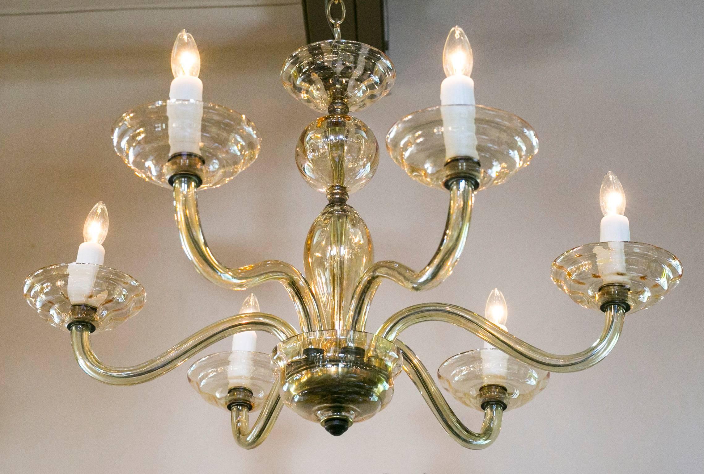 Blown-glass chandelier from Murano, Italy. Six arms with candelabra sockets, newly wired for the US with all UL listed parts. Comes with brass chain and canopy. In the Moderne style with interesting texture/pattern in the bobeche.