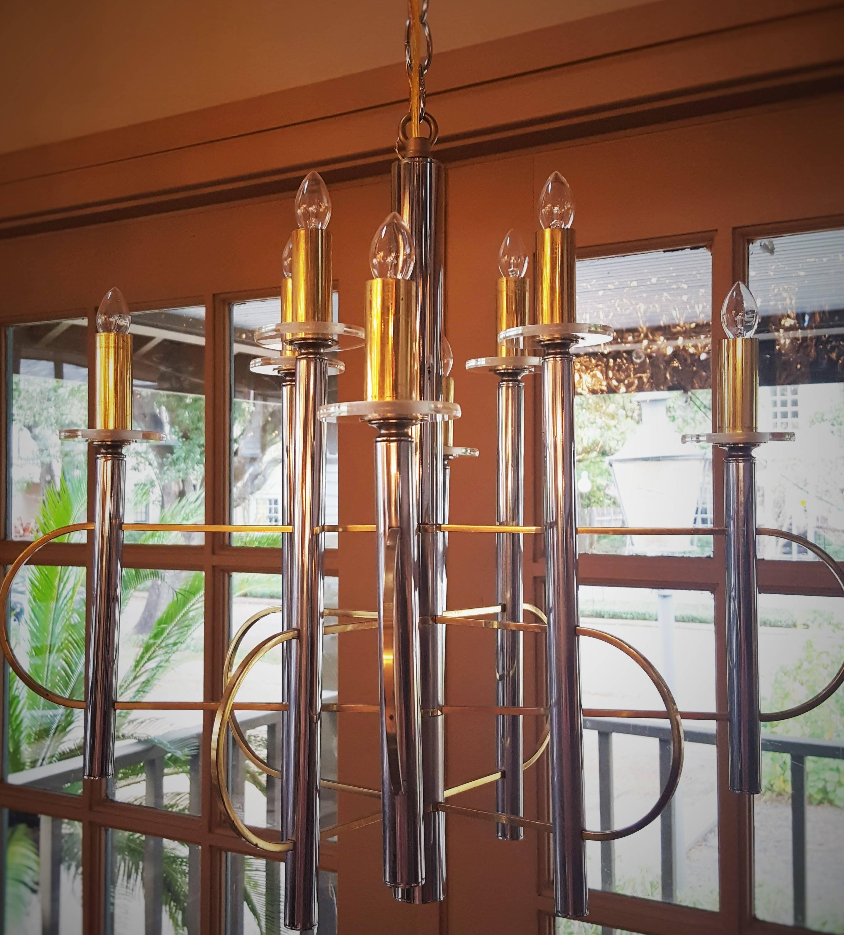 Geometric, Art Deco style chandelier with eight candelabra sockets. Newly wired for the USA with all UL approved parts. Brass candle covers sit on glass bobeche. Comes with a chrome canopy and chain.  Original Sciolari sticker inside of the canopy.