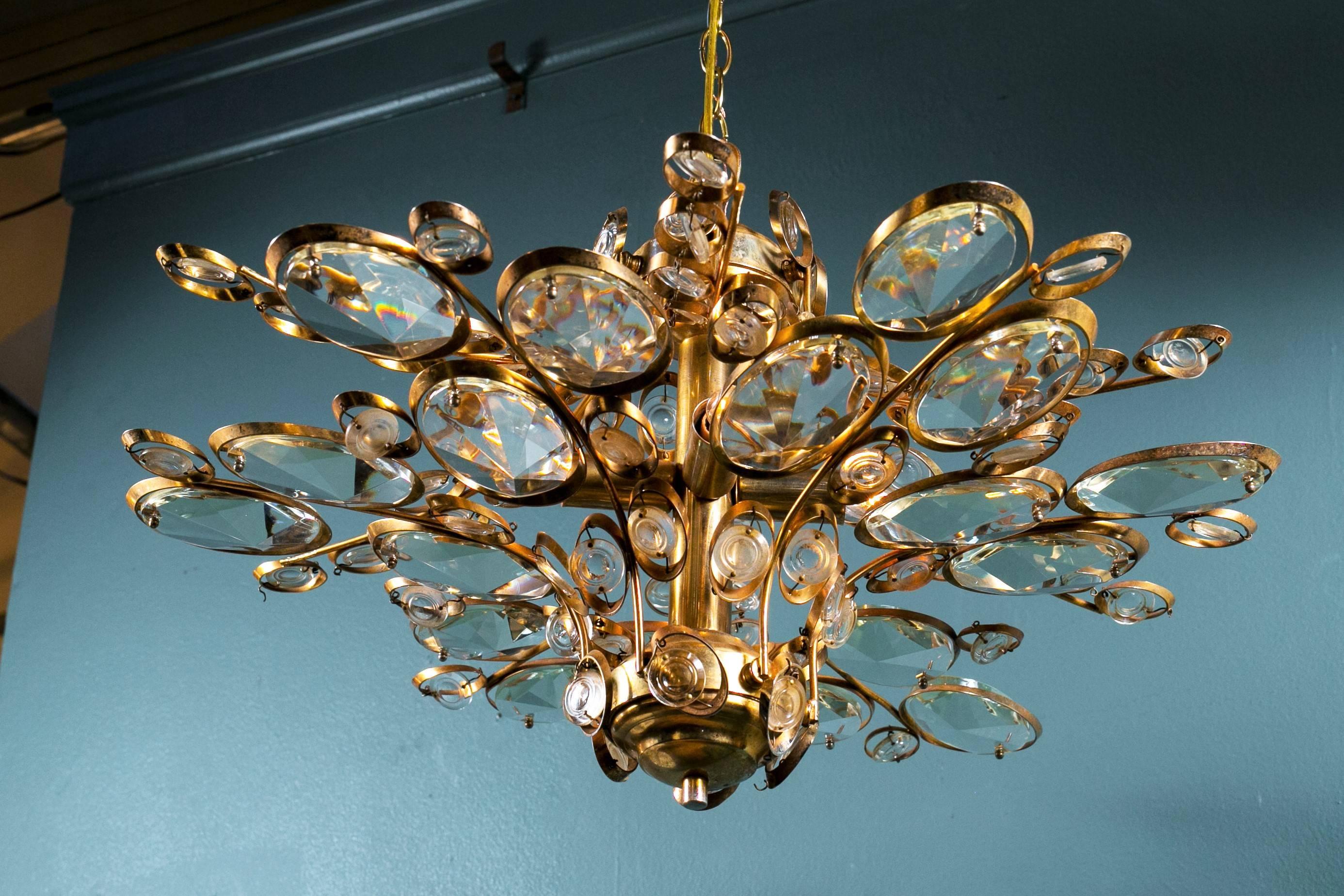 Palwa Mid-Century Modern light with four internal candelabra sockets, newly rewired for use in the USA with all UL approved parts. Round glass discs float inside a gilt brass frame.  Interesting shape from all angles.  All original parts and glass