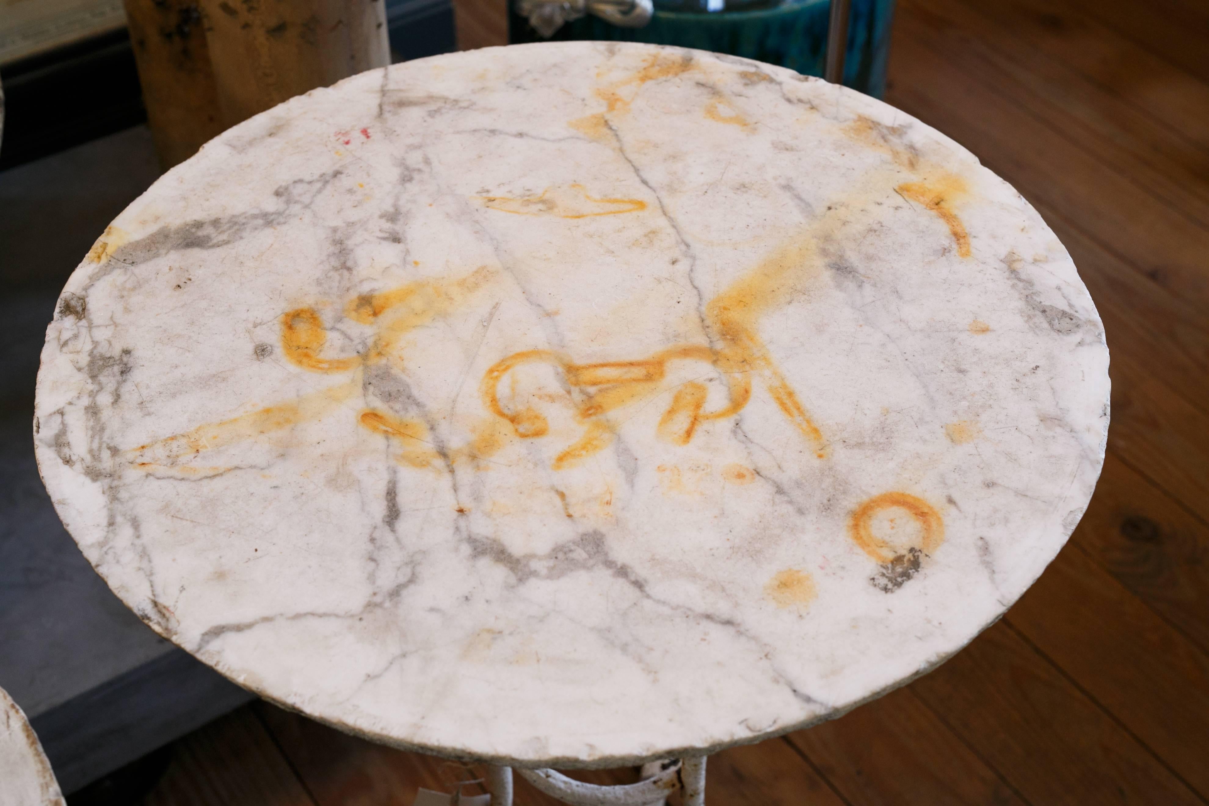 Antique white iron gueridon table with raw marble top from France, circa 1900.
Original paint.