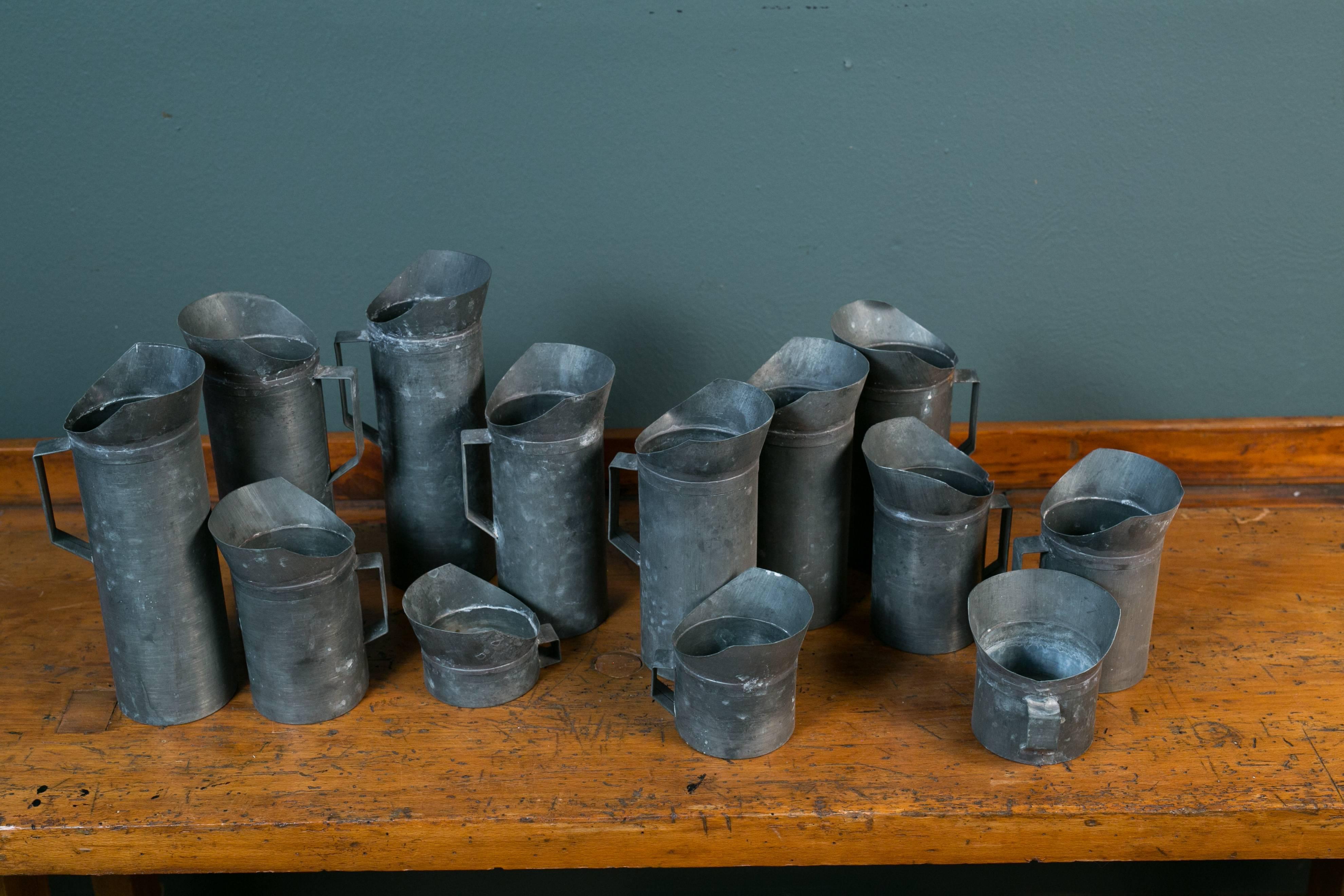 Industrial Set 13 French Zinc Hand-Crafted Pitchers, circa 1940