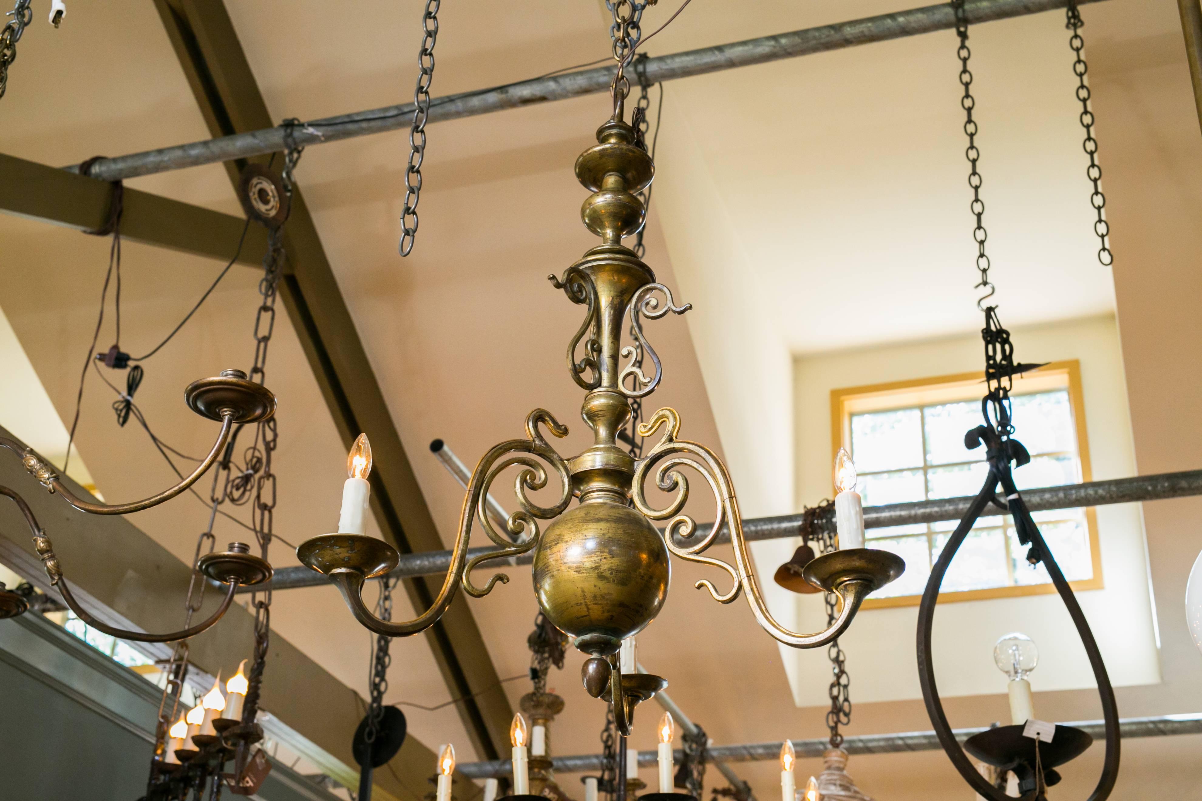 Heavy bronze Flemish style chandelier, circa 1900. Interesting patina on the metal. Newly rewired for use in the USA with all UL approved parts and three candelabra sockets. Comes with matching chain and canopy.