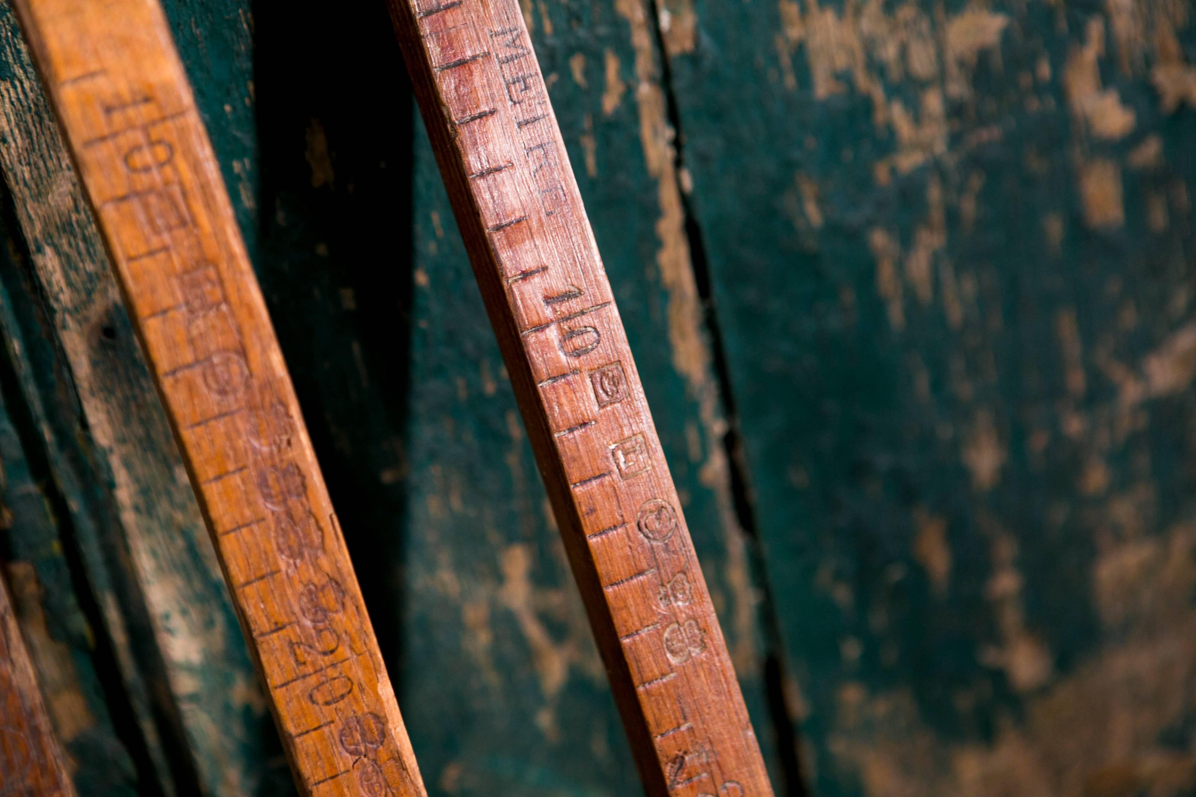 Antique wooden meter sticks from Belgium. Most have brass caps on one or both ends of the stick. More available. Sold together as a set of five for $575, but may be priced individually for $140 each. Each varies slightly and some are a bit shorter