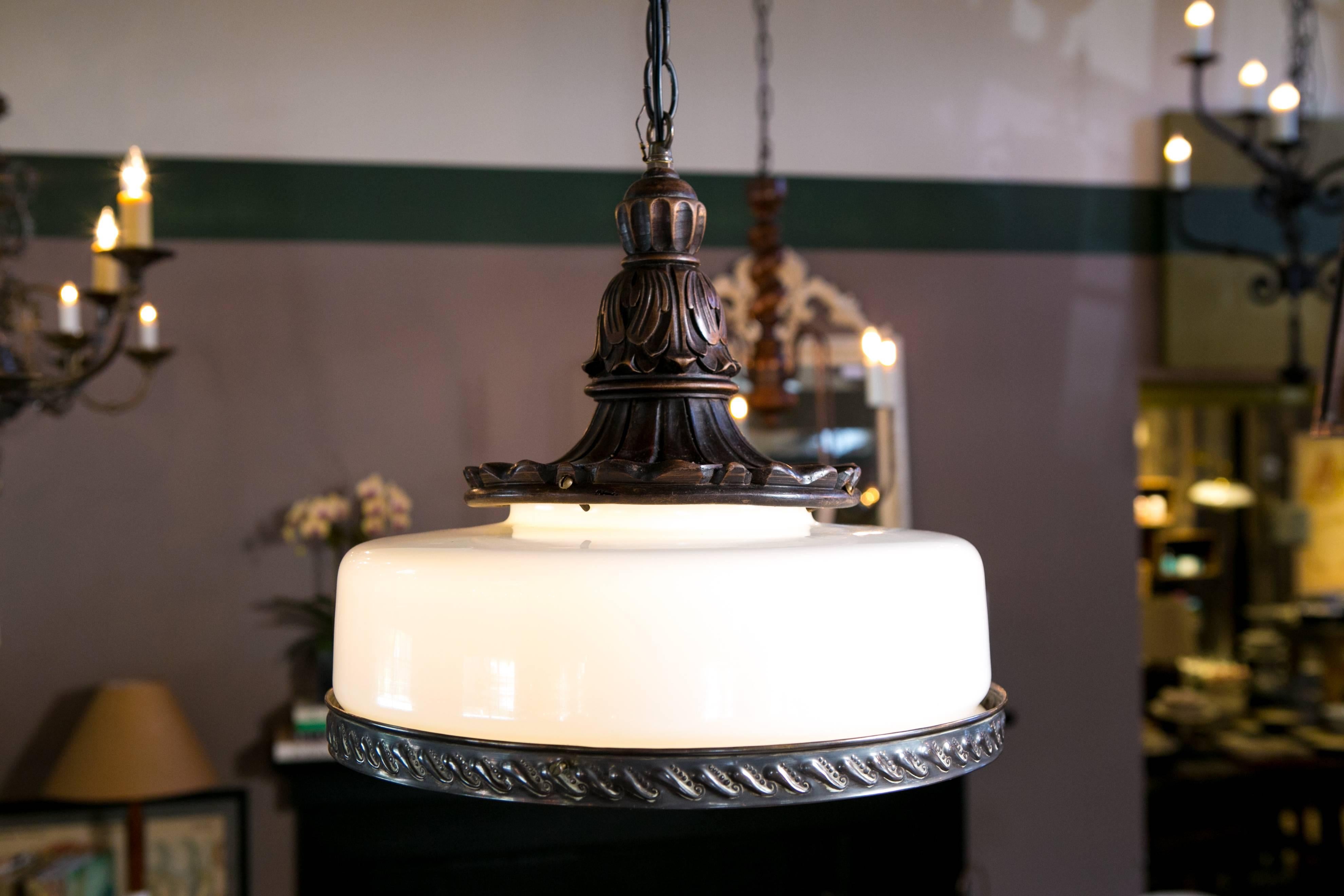 One of a kind handblown vintage milk glass shade with stamped brass banding and a hand-carved antique wood top. Newly wired in the USA with all UL listed parts and a single porcelain Edison socket. Our exclusive design made from vintage and antique