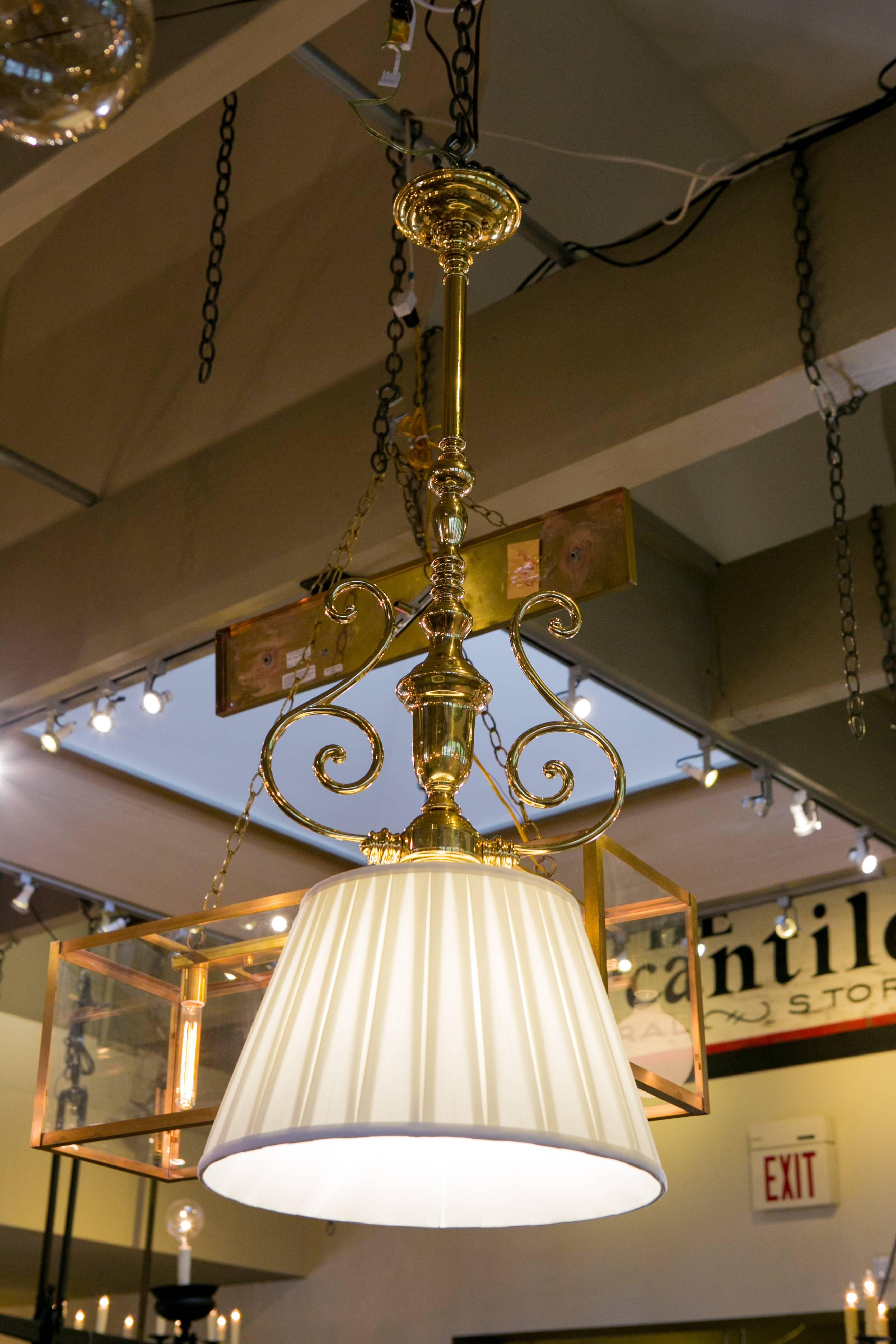 Our one of a kind, custom-made polished brass pendant lights feature a silk box-pleated, soft lined fabric shade and are our exclusive creation. Newly wired with all UL listed parts and a single Edison socket. Diameter listed is of the shade and