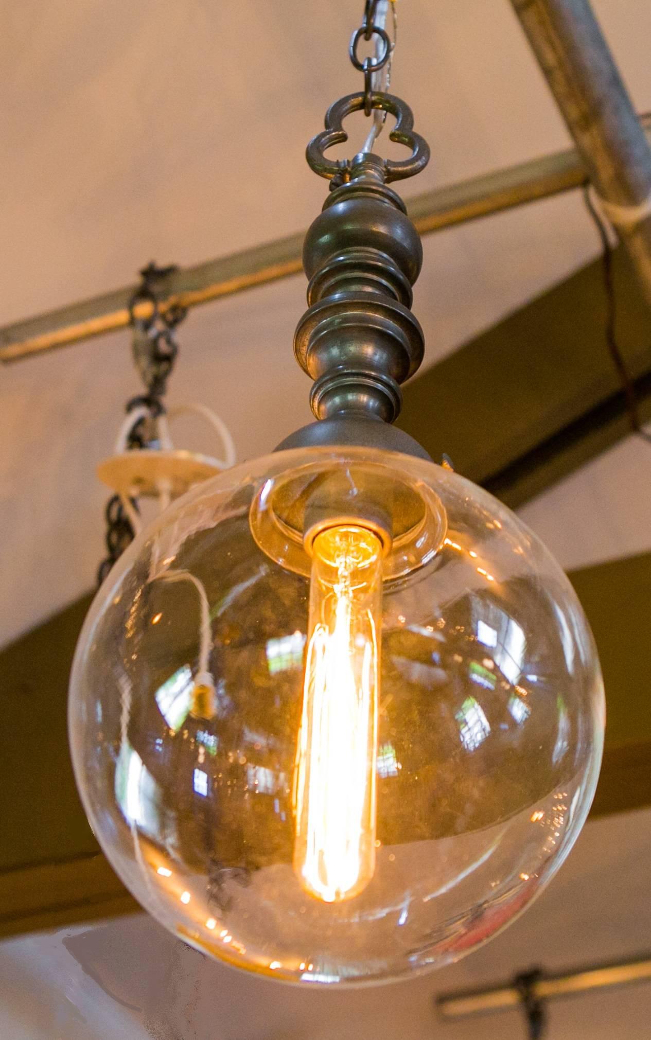 Unusual pewter pendant light with clear blown glass globe and trefoil finial. Our exclusive creation, made from vintage parts. Newly wired in the USA with all UL listed parts and a single porcelain Edison socket, painted silver to match the body.