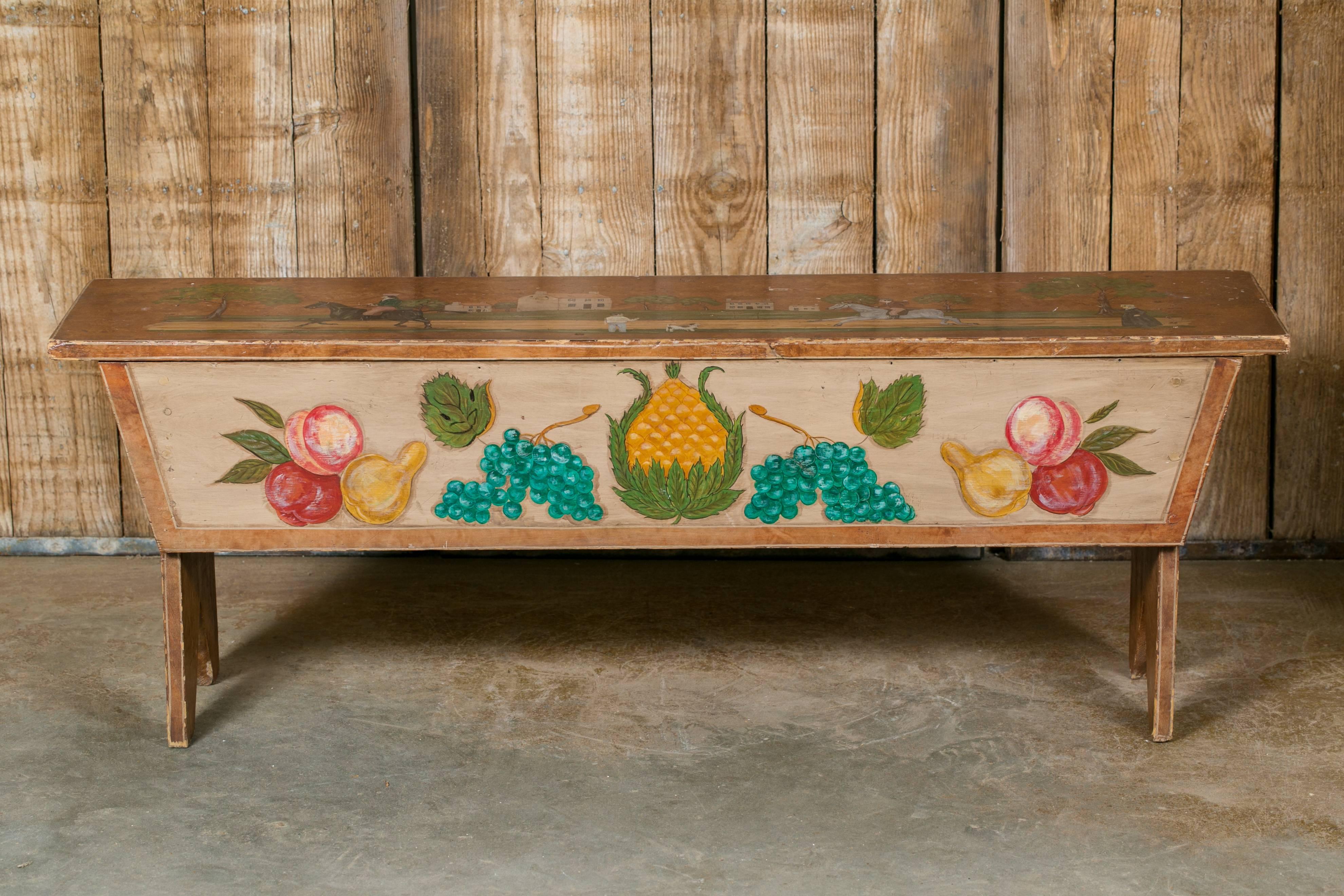 Antique American wooden bench, circa 1890, hand-painted by American Folk Artist, Lew Hudnall, in the 20th century. The scenes on the top and back panel show men on horseback and houses. Scene on the front panel shows a pineapple in the centre,